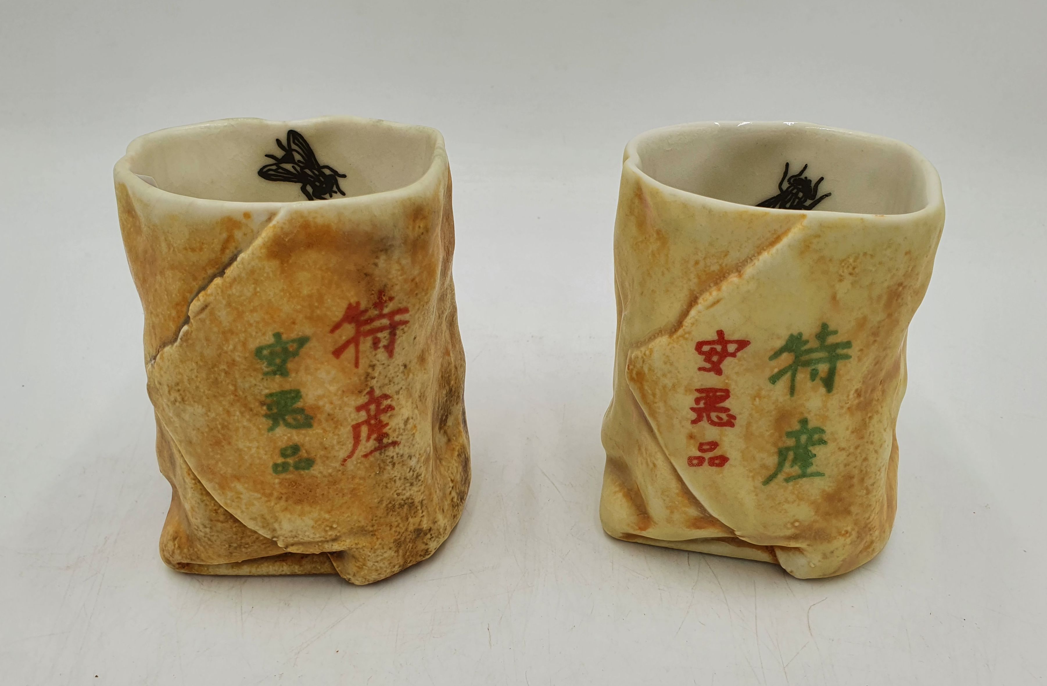 521 · A PAIR OF CHINESE CERAMIC PAPER BAG STYLE VASES