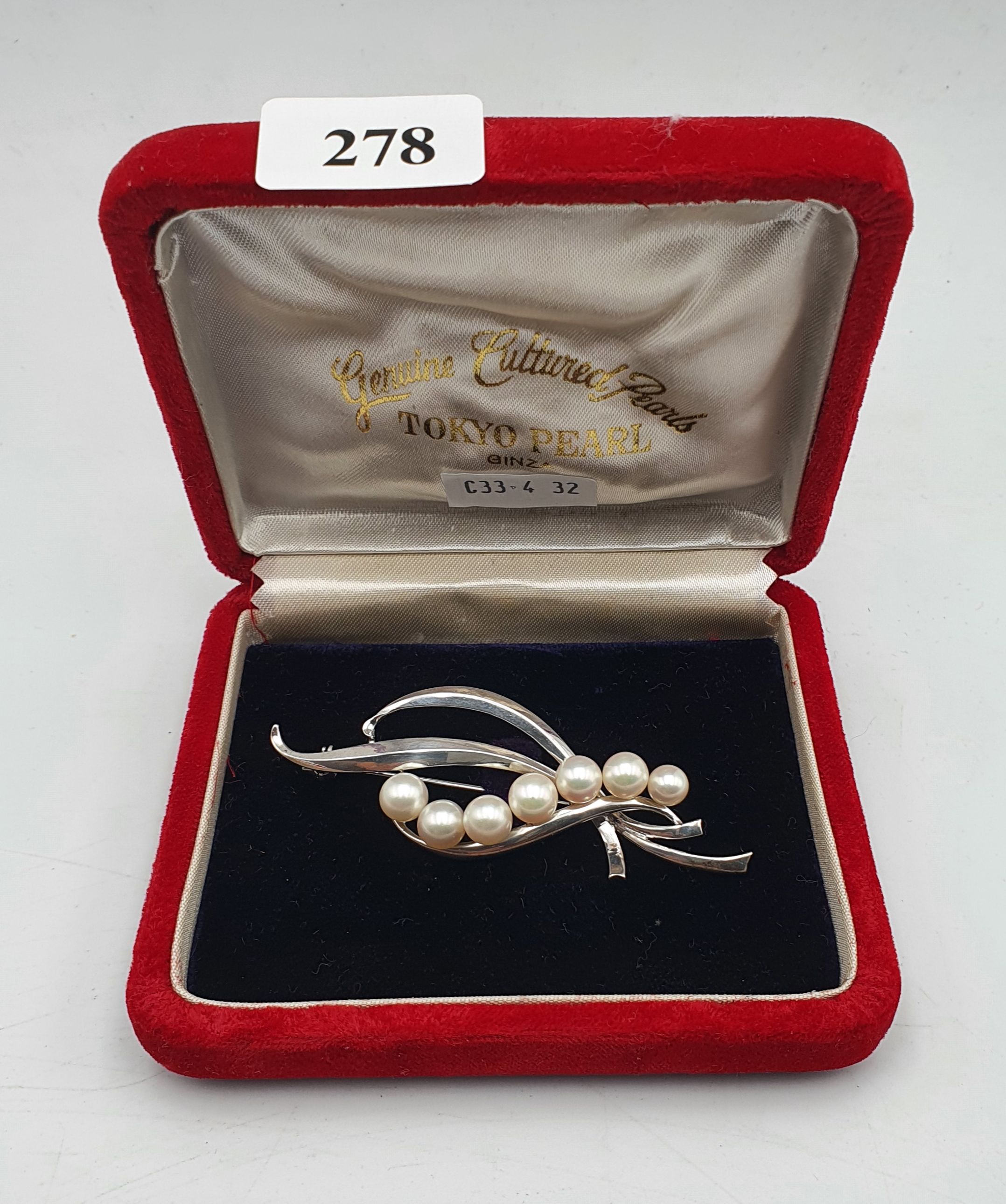 278 · AN AKOYA PEARL STERLING SILVER BROOCH