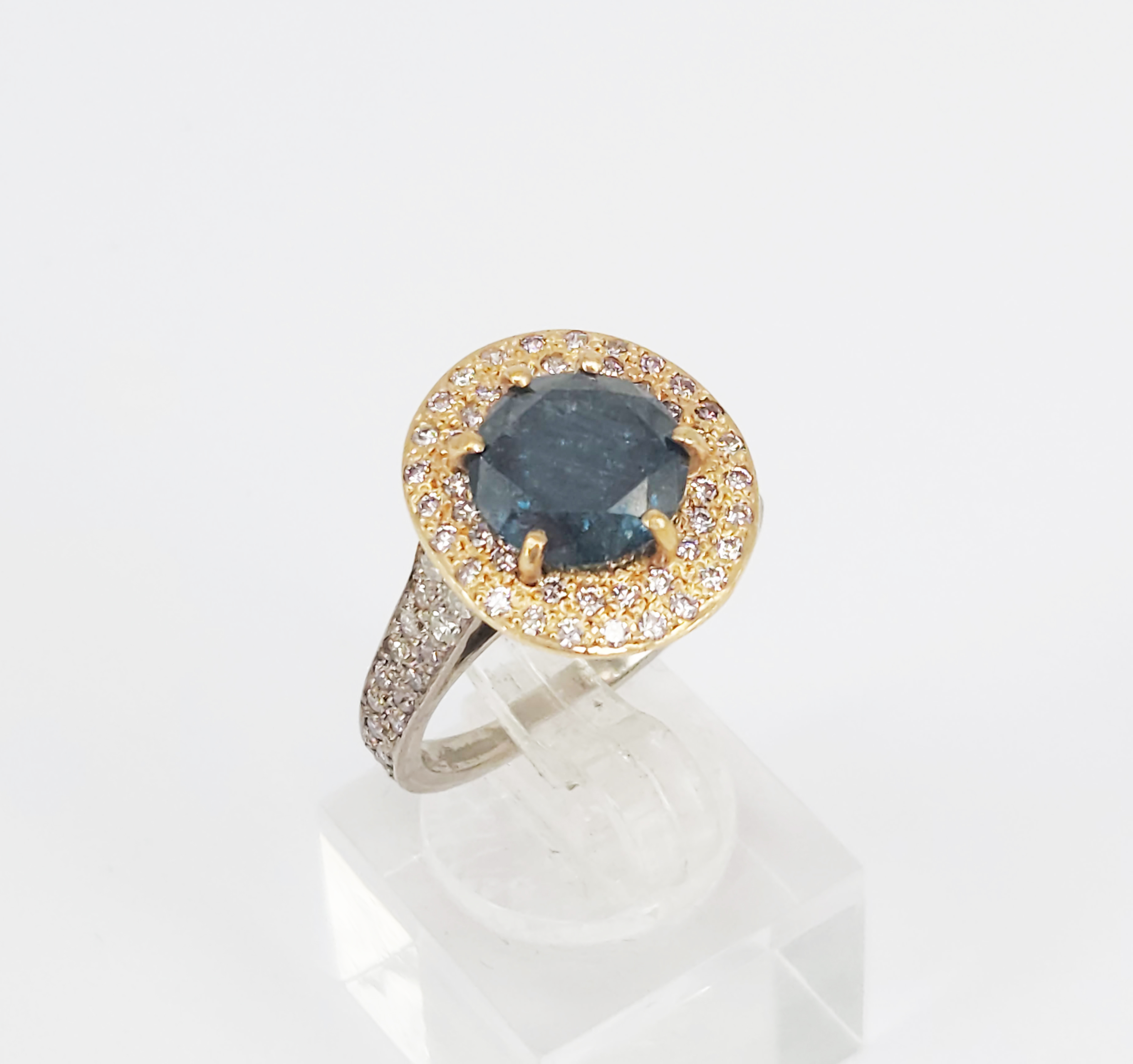 38 · AN 18ct WHITE GOLD PALLADIUM AND 9ct YELOW GOLD TREATED BLUE DIAMOND COCKTAIL RING