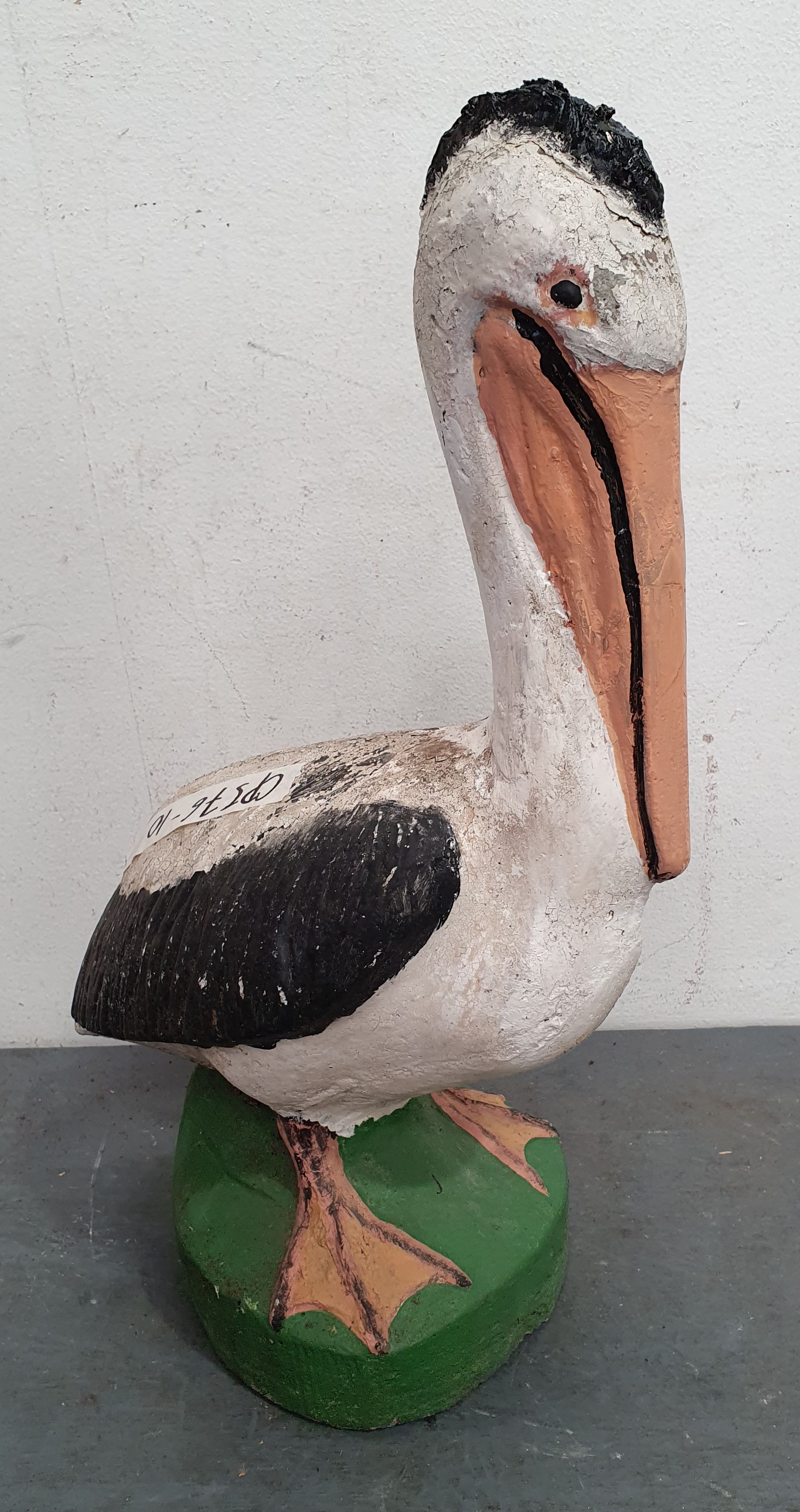1111 · A CONCRETE STATUE OF A PELICAN