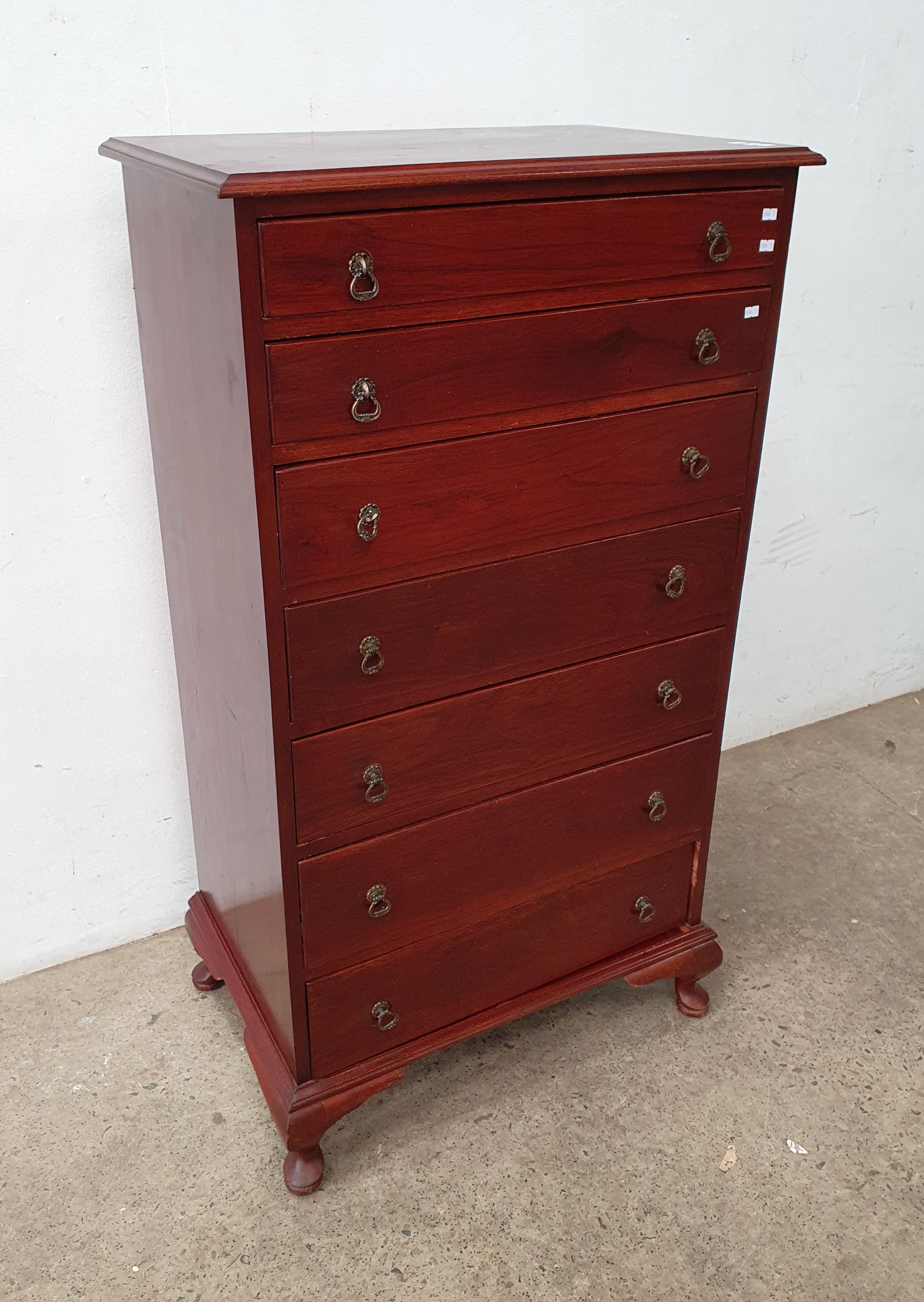 A Tall Chest Of Cedar Drawers