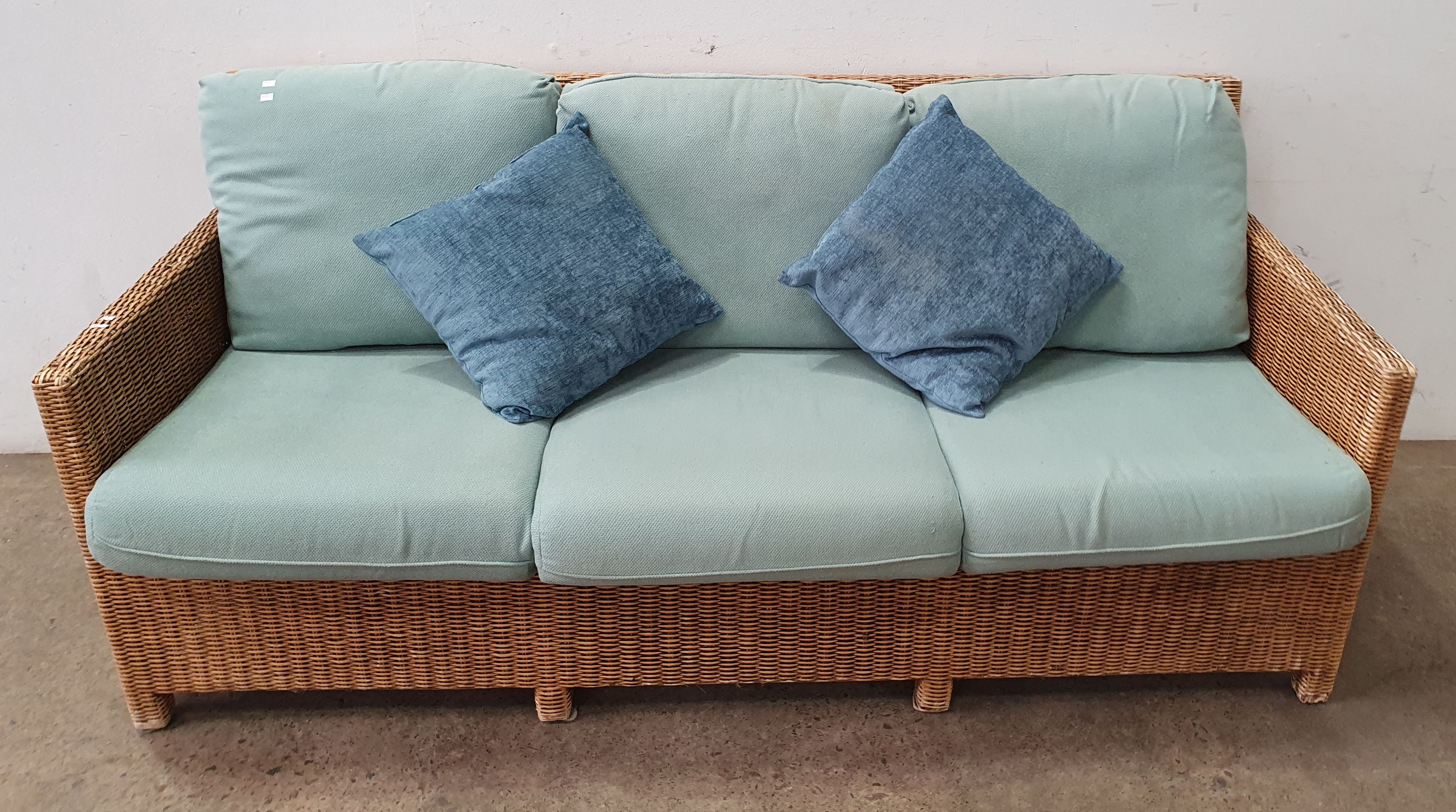 A Woven Cane Three Seater Sofa