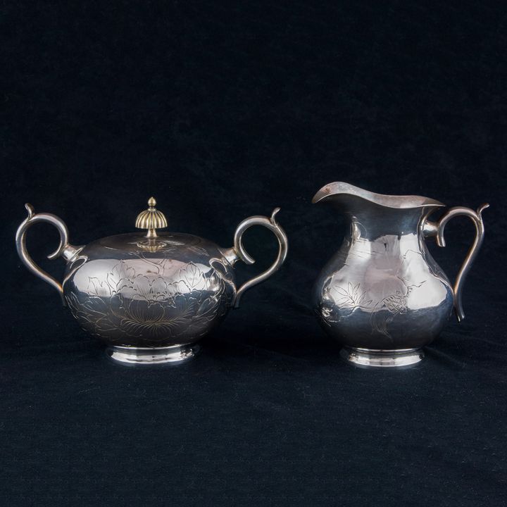 A Japanese silver creamer and sugar set