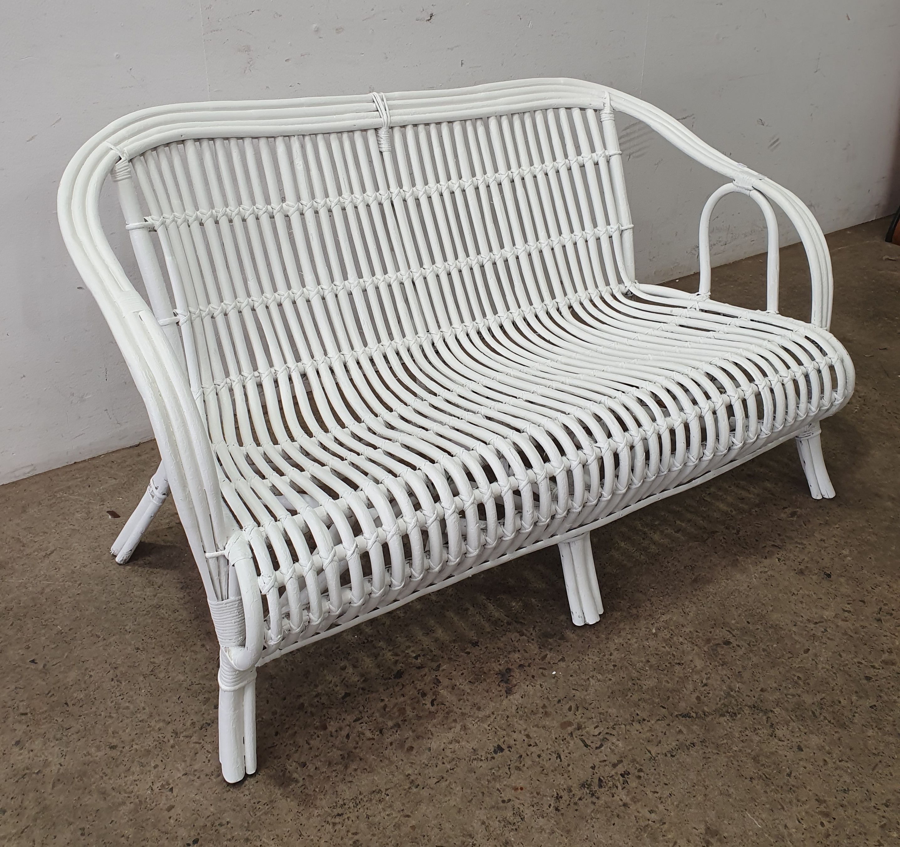 1067 · A PAINTED CANE SETTEE