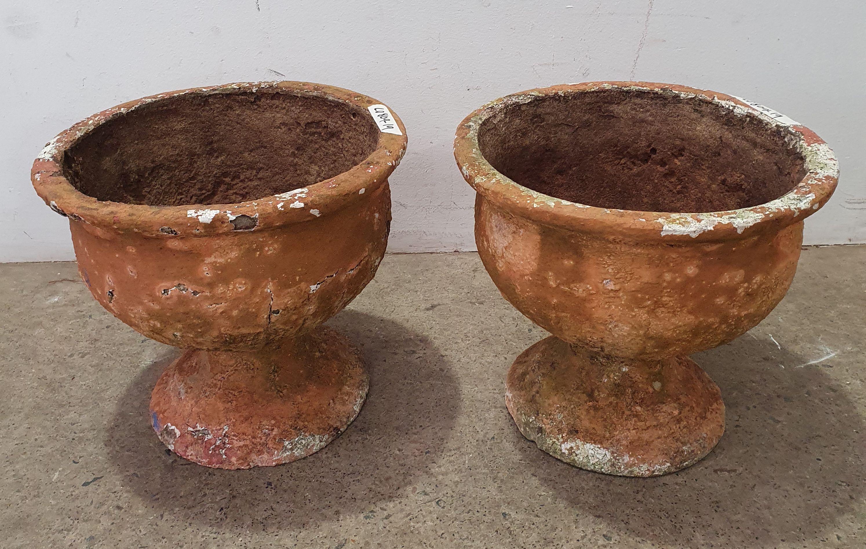 A Pair Of Concrete Planters