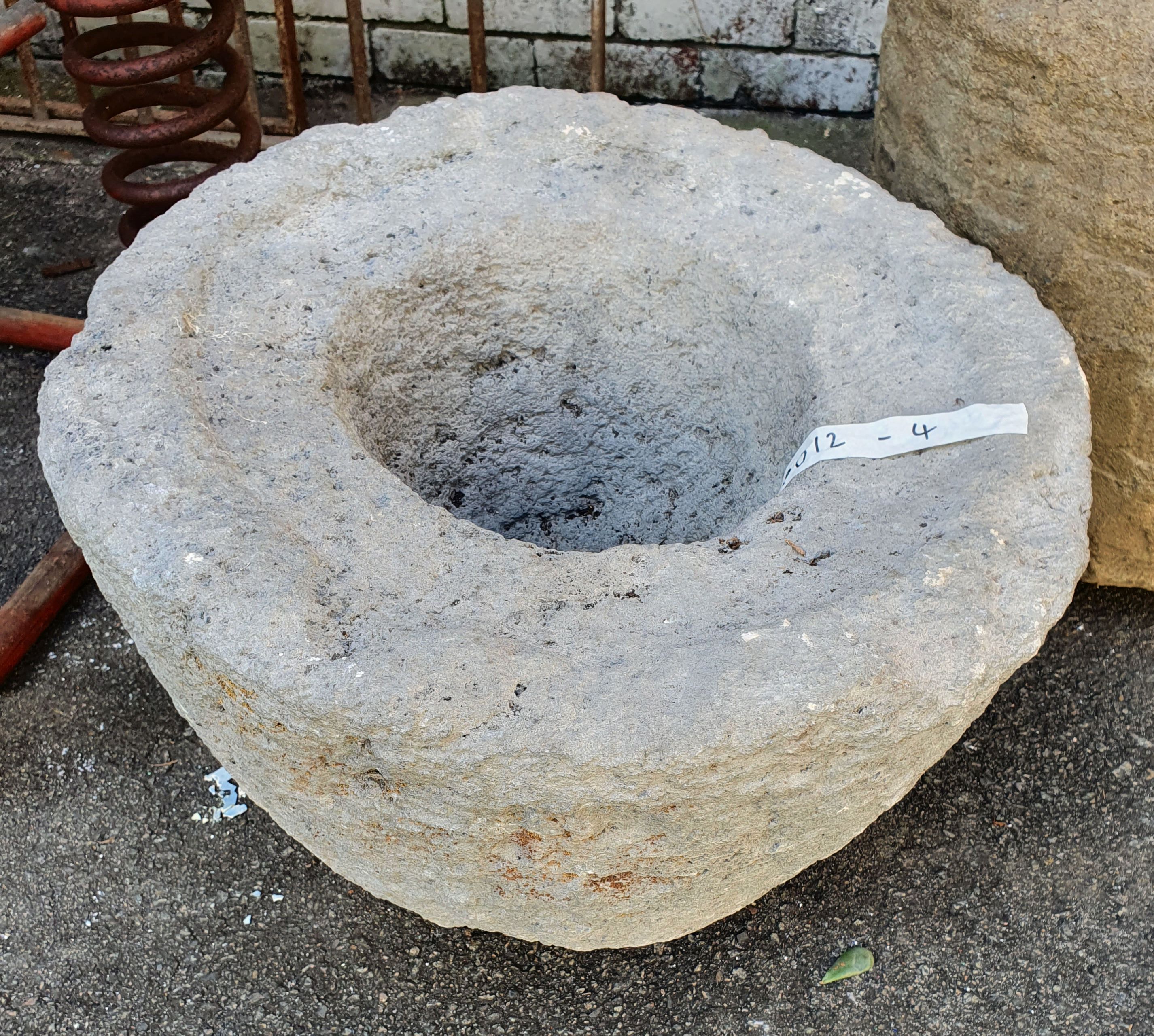 1168 · A HEAVY DECORATIVE STONE PLANT POT