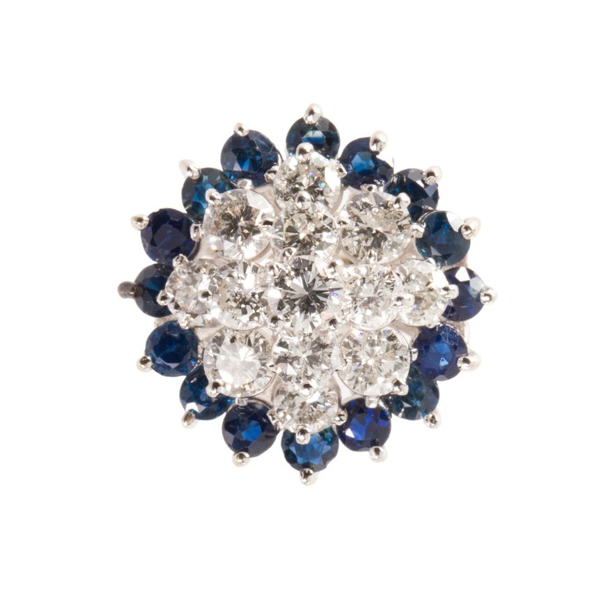 A diamond, sapphire and fourteen karat white gold ring
