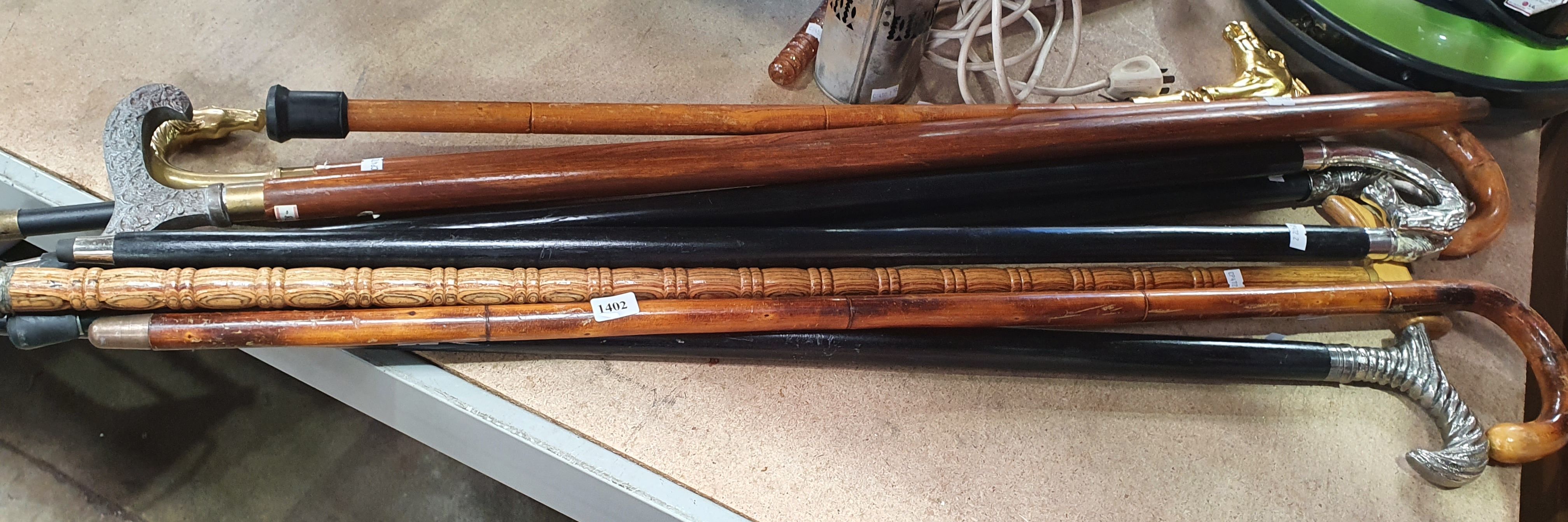 1402 · ELEVEN VARIOUS WALKING STICKS