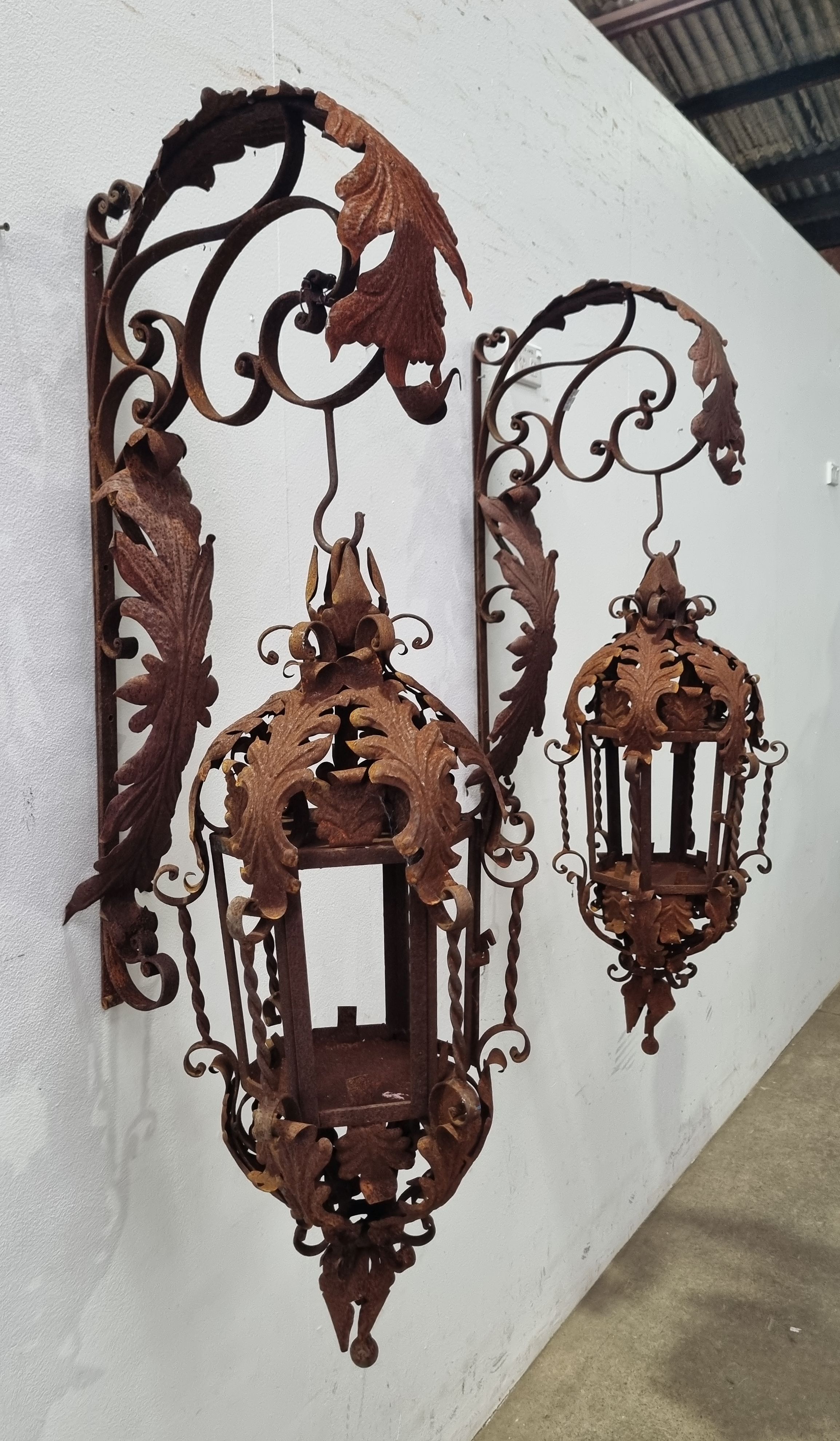 A Pair Of Wrought Iron Lanterns