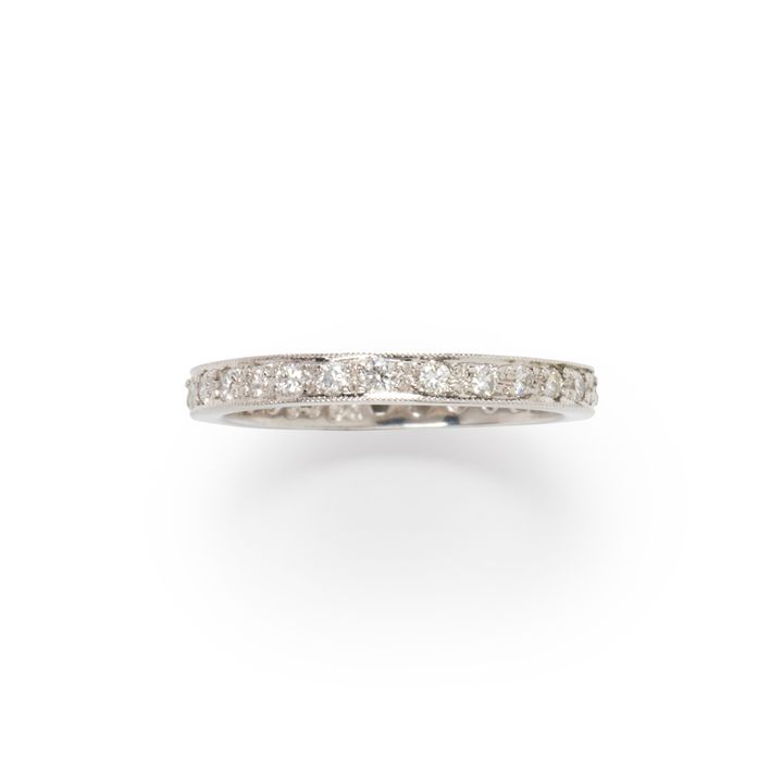 A diamond and platinum band ring