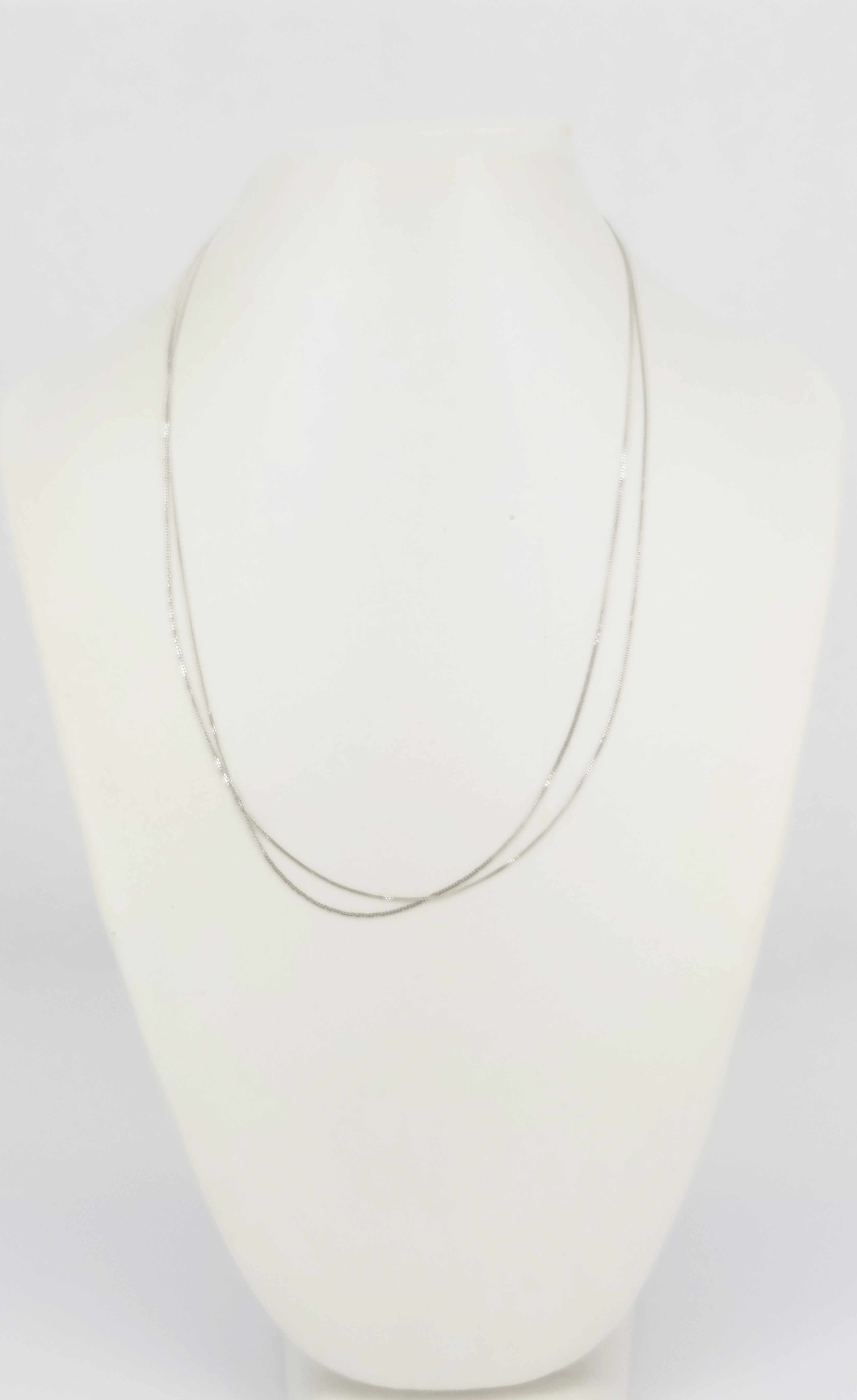 126 · TWO FINE 9ct WHITE GOLD CHAIN
