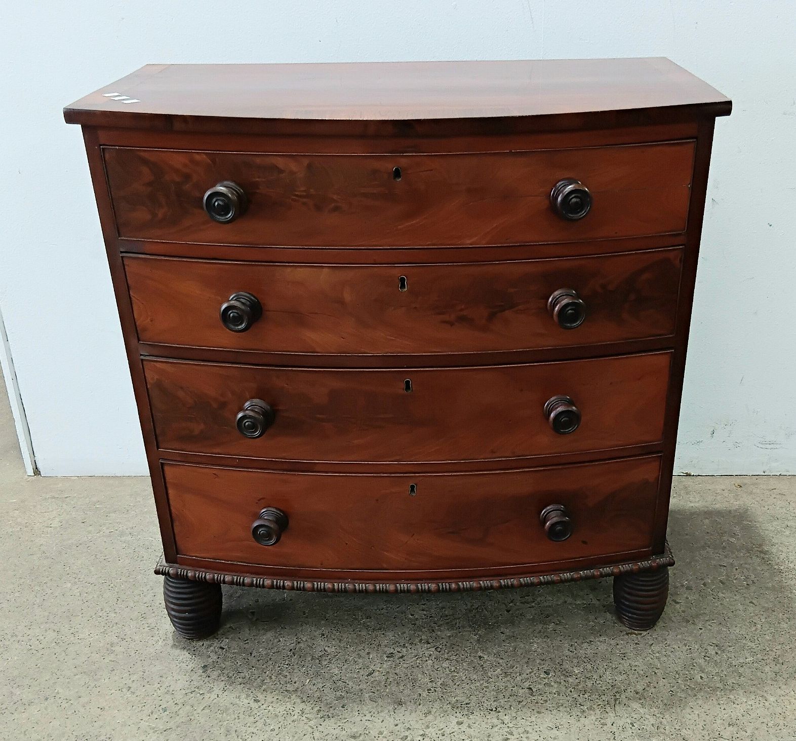A Georgian Mahogany Bow Front Chest Of Four Drawers