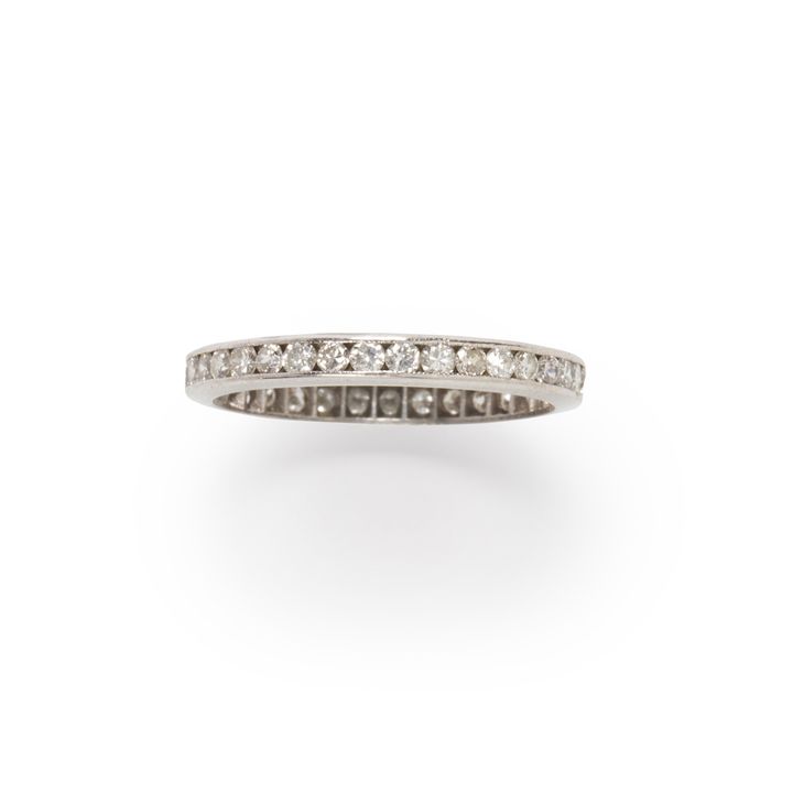 A diamond and platinum band ring
