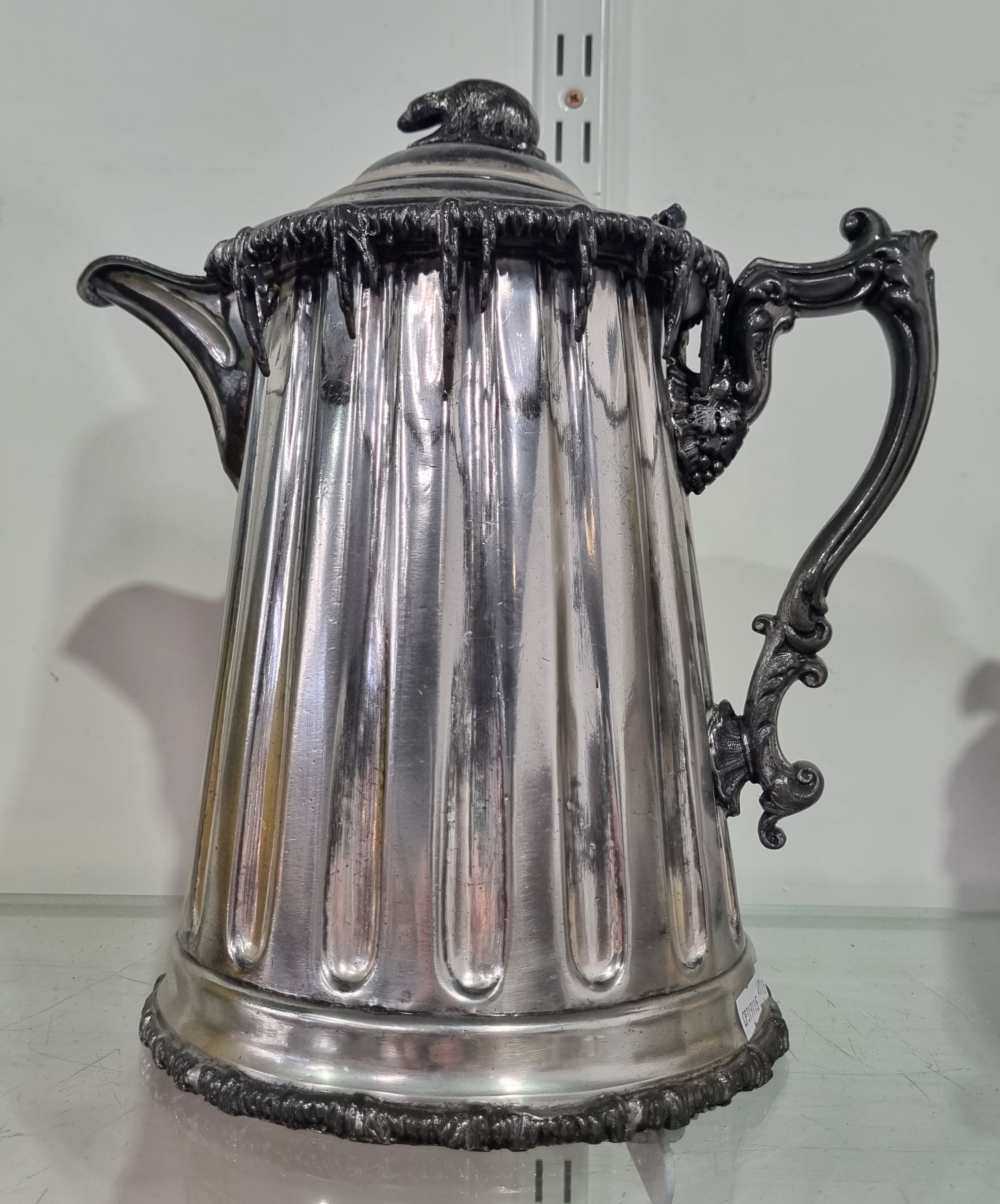 A LATE VICTORIAN SILVER PLATED ICED WATER JUG