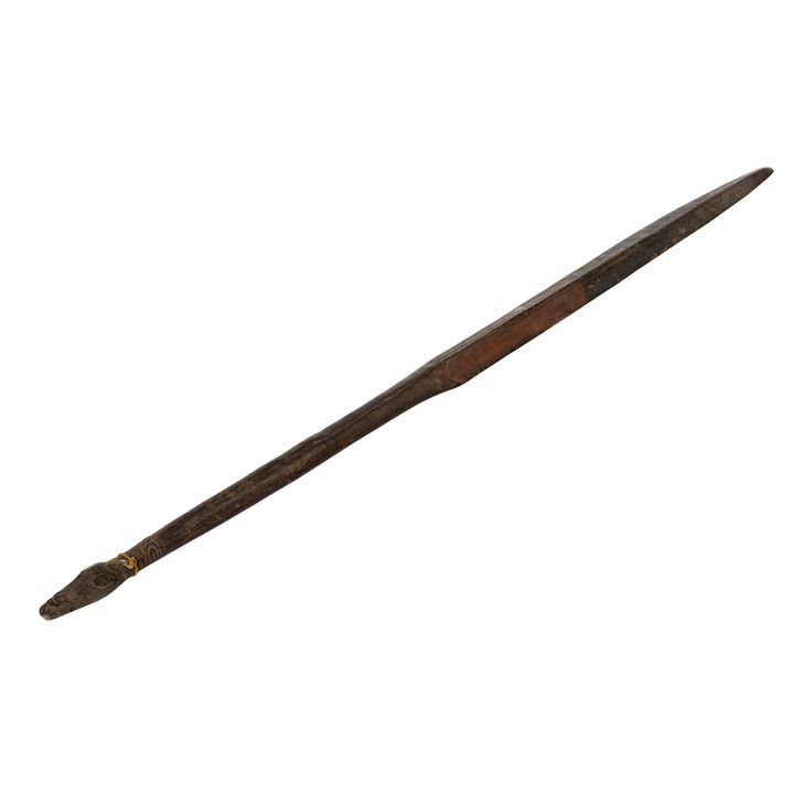 A Papua New Guinea club carved with a crocodile finial