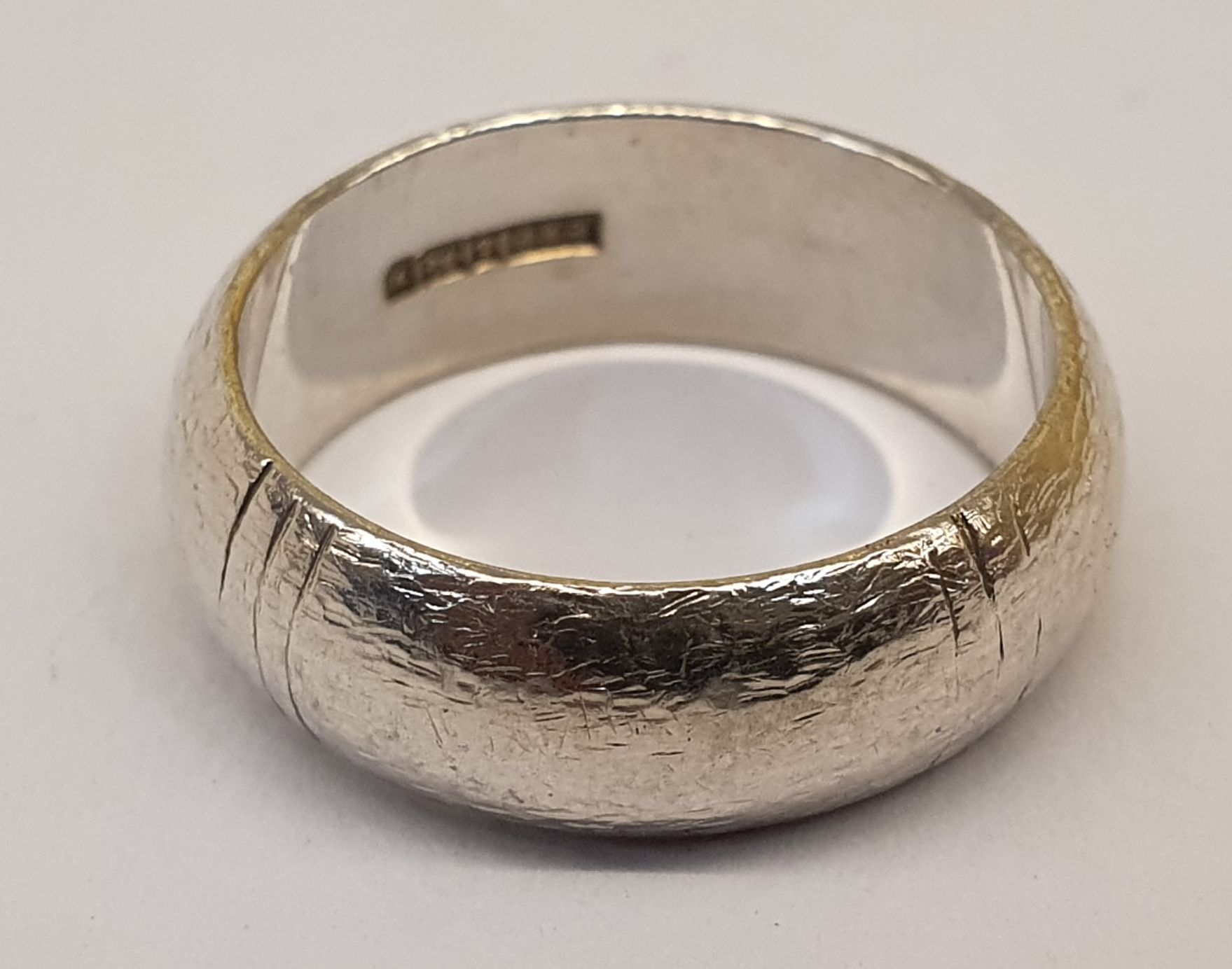 300 · AN ENGLISH HALLMARKED SOLID SILVER WEDDING BAND