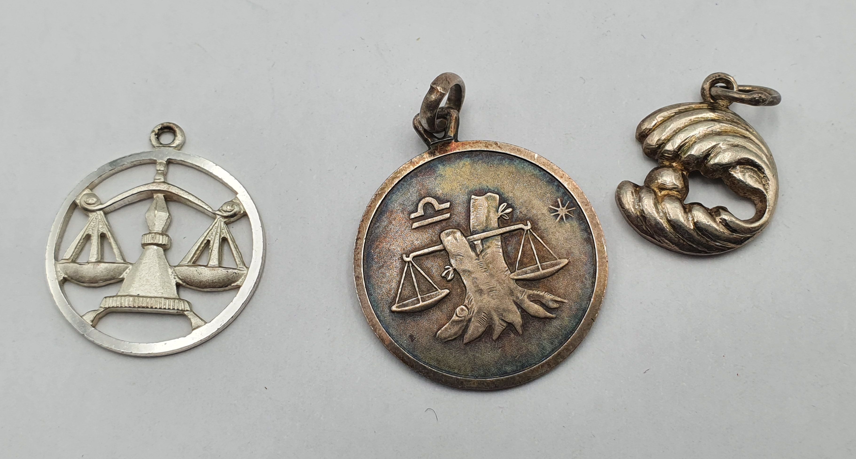 THREE SILVER PENDANTS