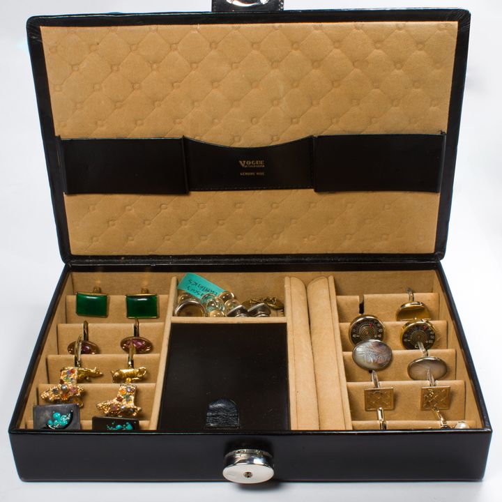 A group of glass, plastic and metal cufflinks