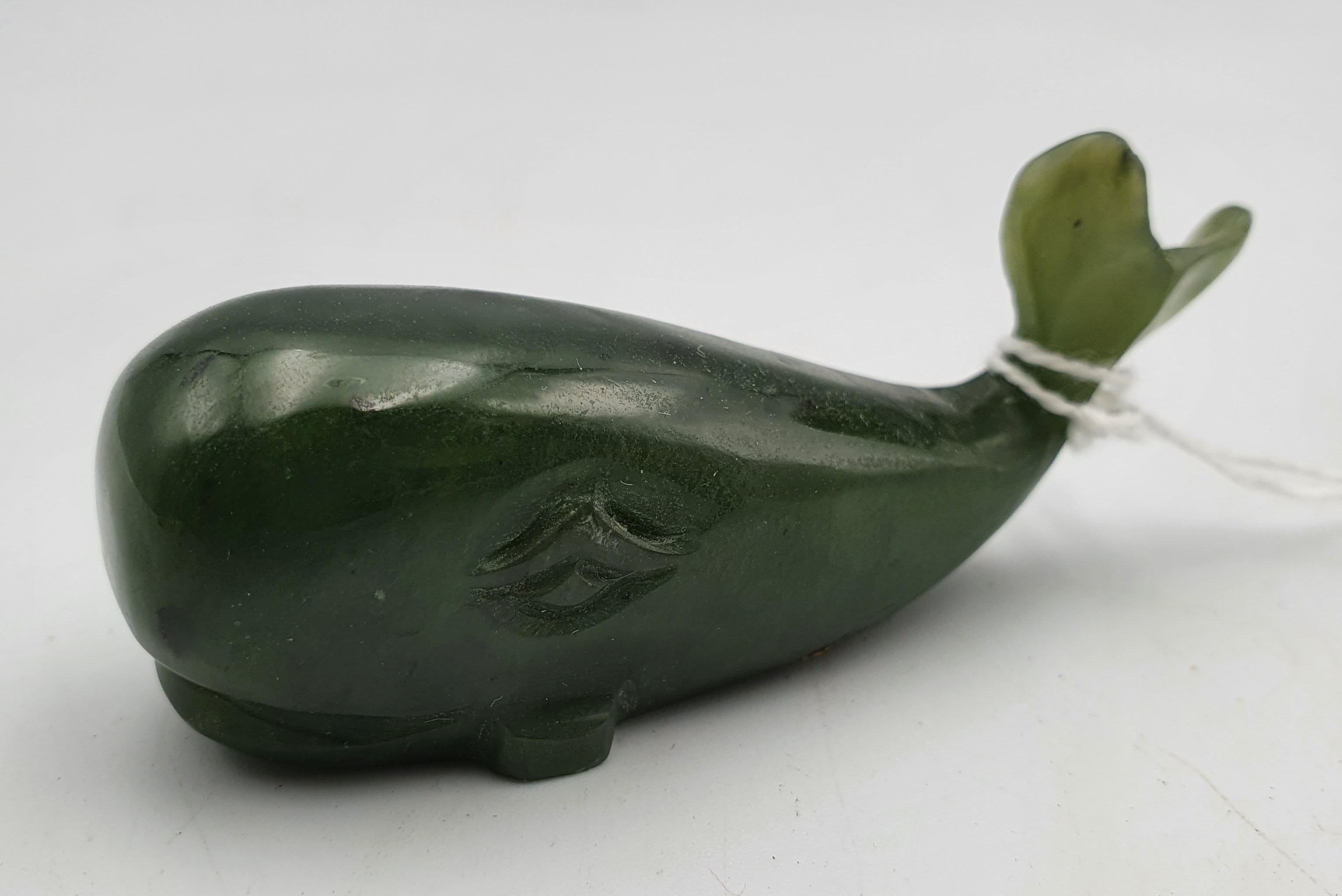 257 · A CARVED GREEN STONE WHALE