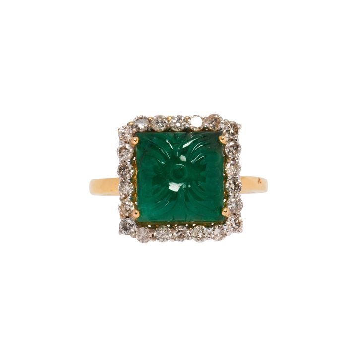 An emerald, diamond and 18k gold ring