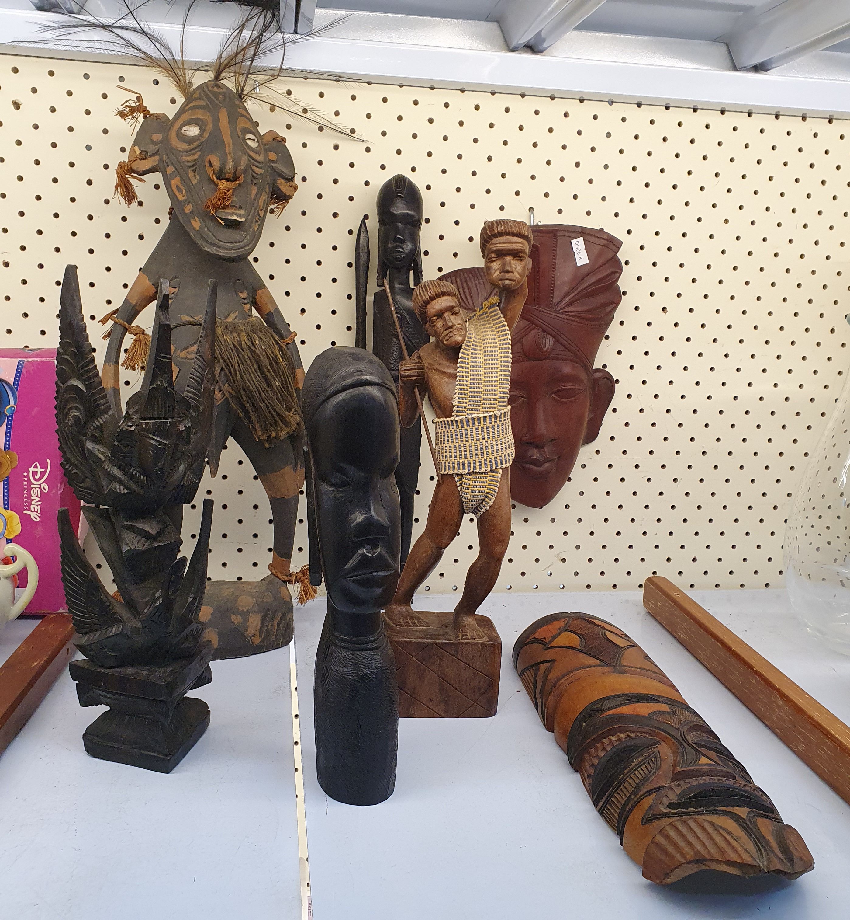 53 · A GROUP OF CARVED TIMBER TRIBAL FIGURES