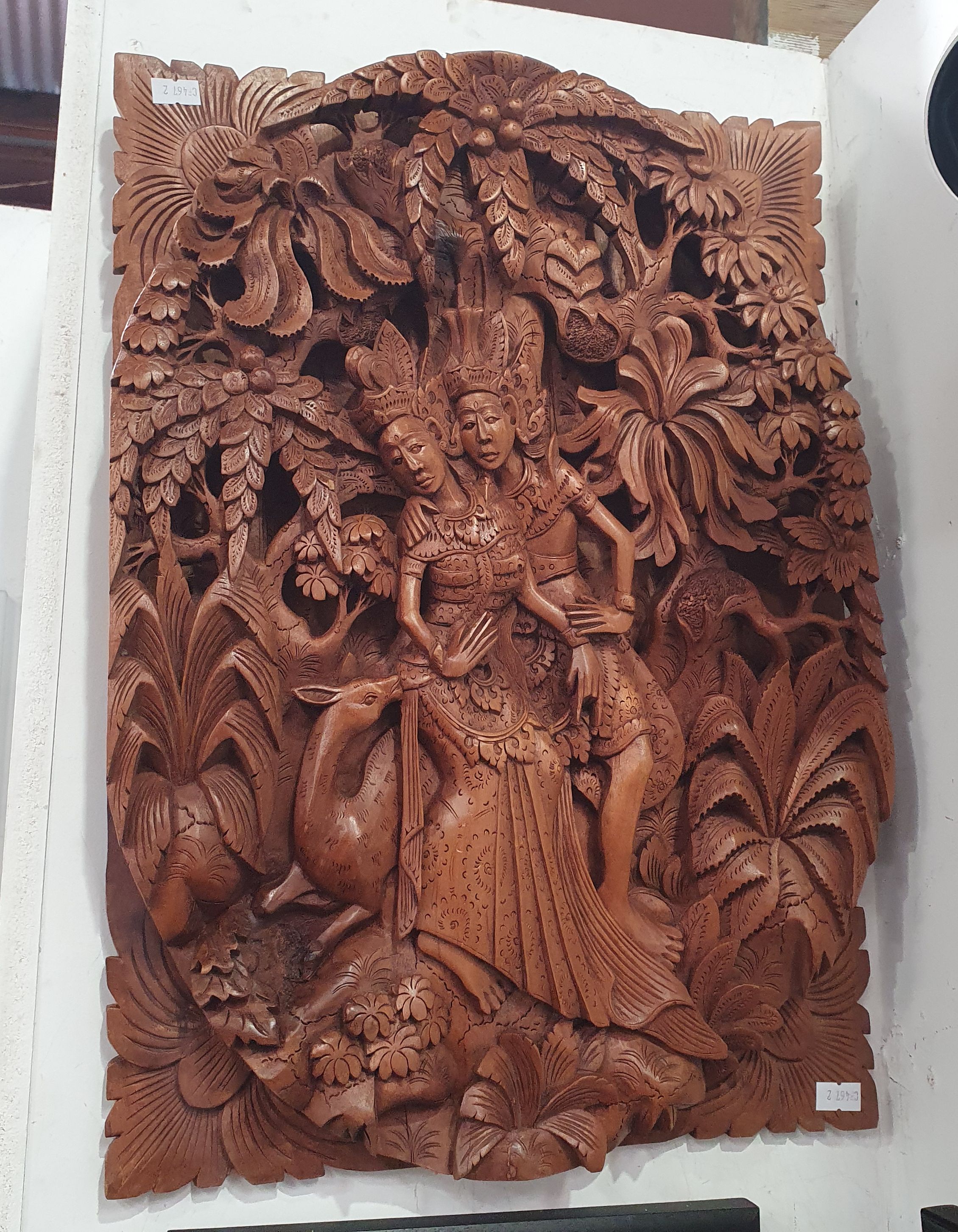 621 · A HAND-CARVED BALINESE HARDWOOD RELIEF PANEL