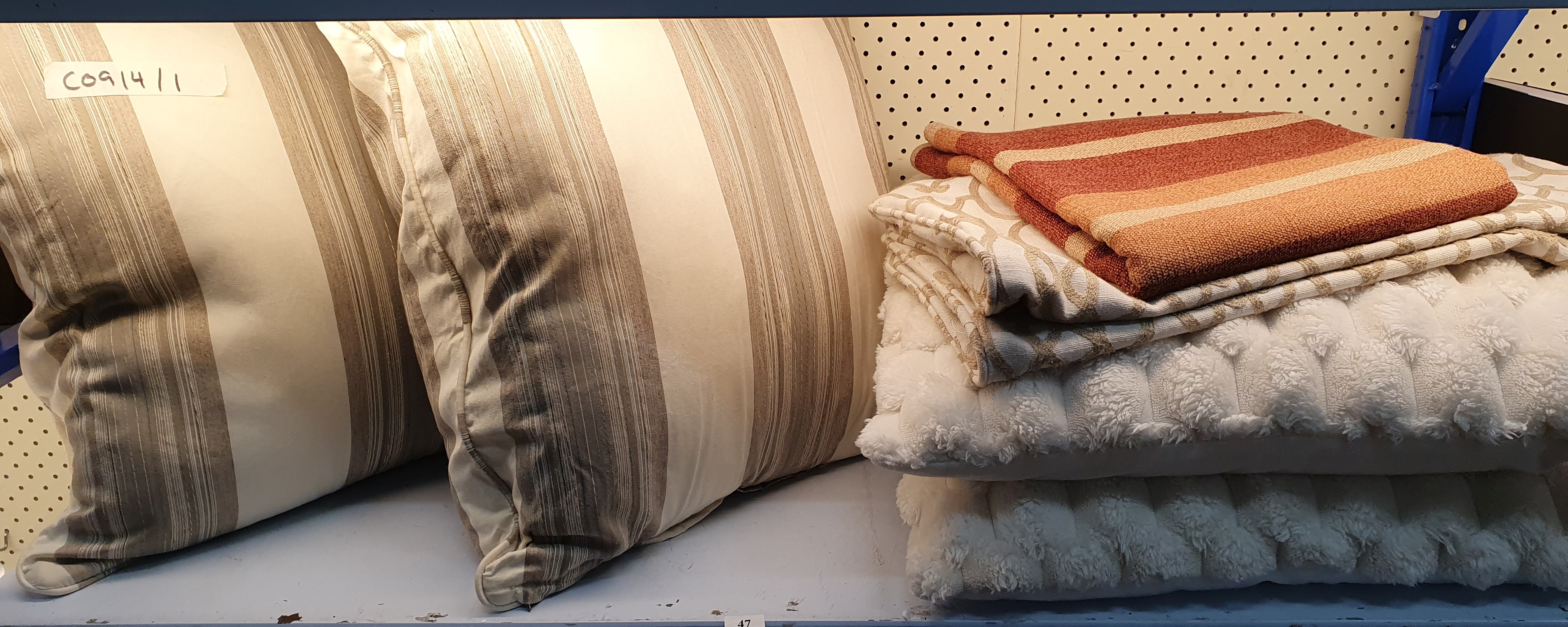 47 · FOUR CUSHIONS AND TWO PIECES OF LINEN TAPESTRY FABRIC