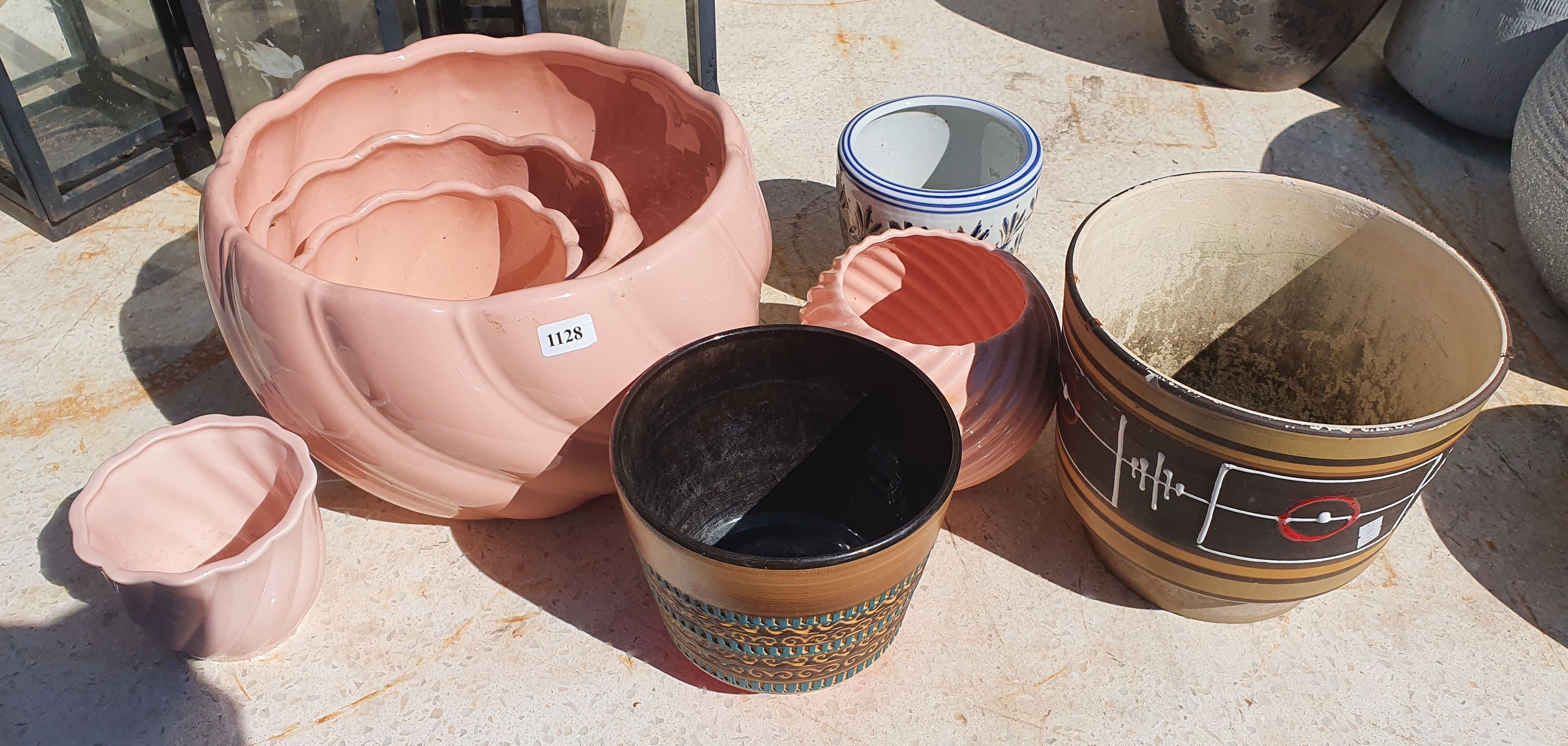 1128 · A GROUP OF POTTERY PLANTERS