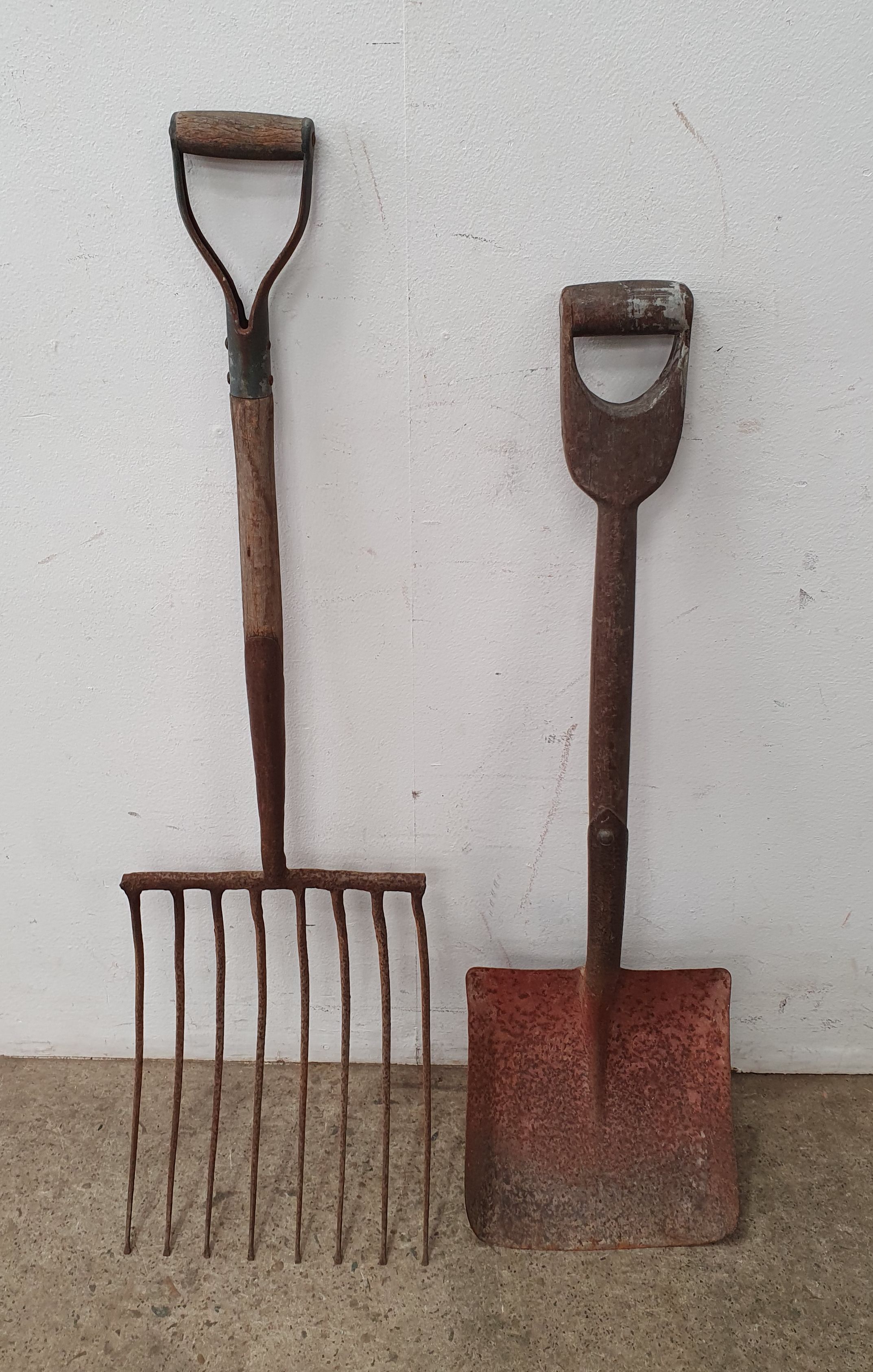 A Rustic Shovel And Pitchfork