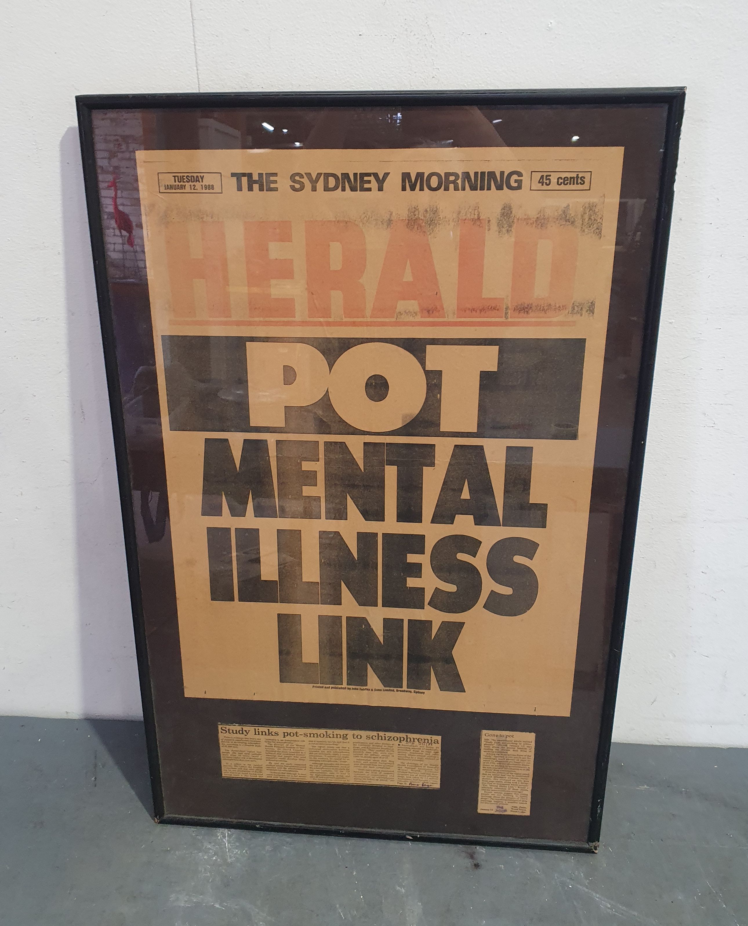 A FRAMED SYDNEY HERALD FRONT PAGE