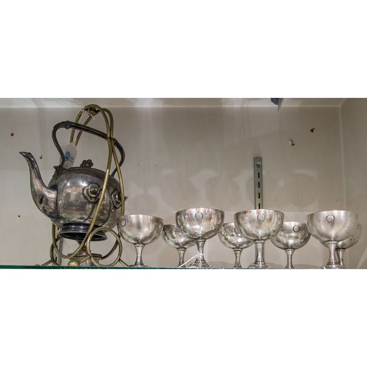 An English plate teapot on stand and eight Harrods triple Crown plate sherbert cups, 19th century, the teapot on tilting stand with ...
