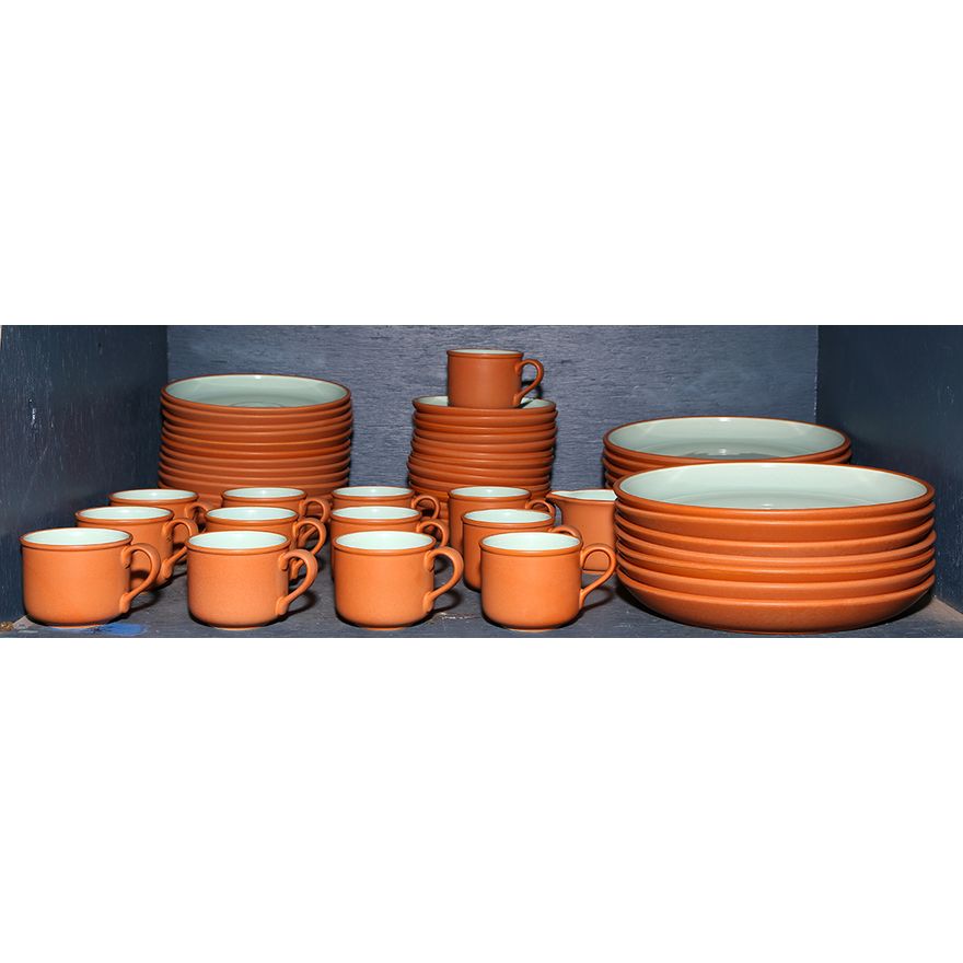 One bin of a ceramic table service with terra cotta and aqua glaze, consisting of (15) dinner plates, (13) coffee cups, (15) saucers...