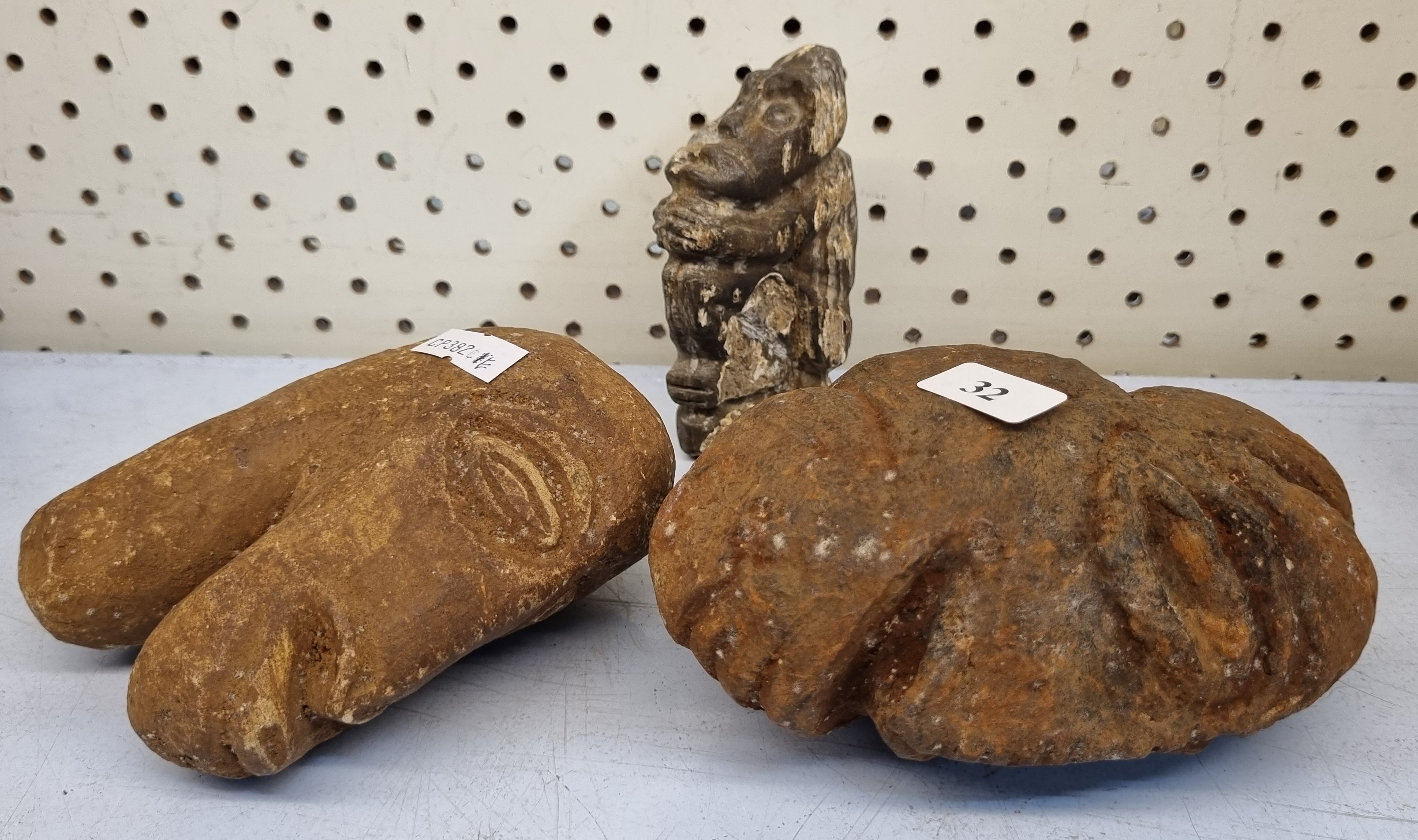 32 · THREE CARVED STONE FIGURES