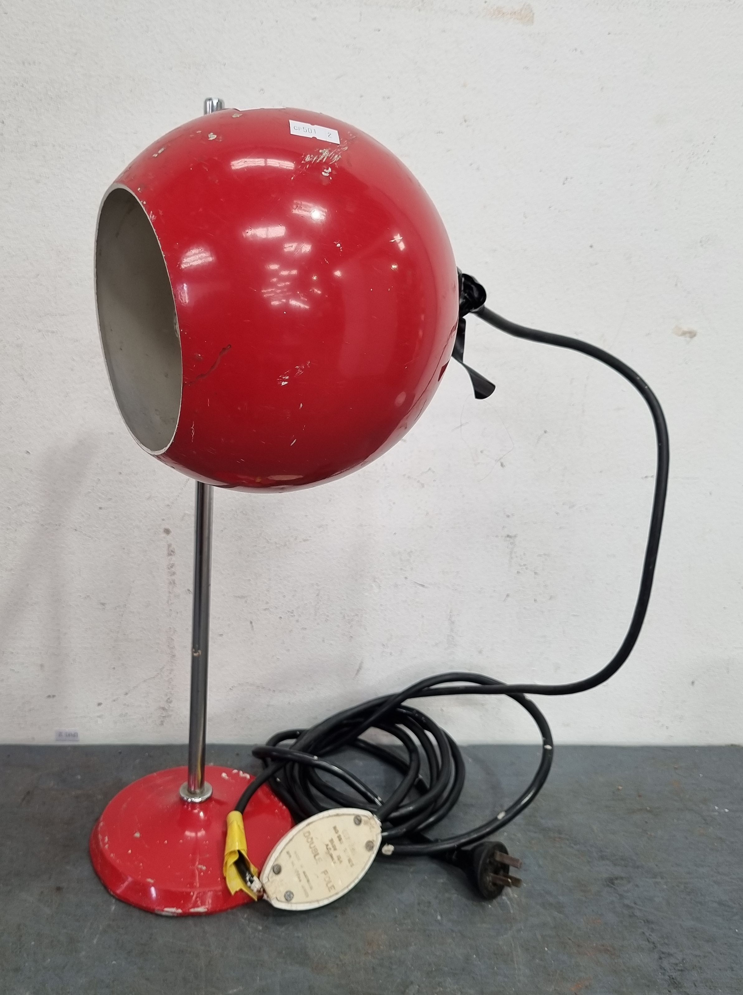 A RED MID-CENTURY SPOT LAMP