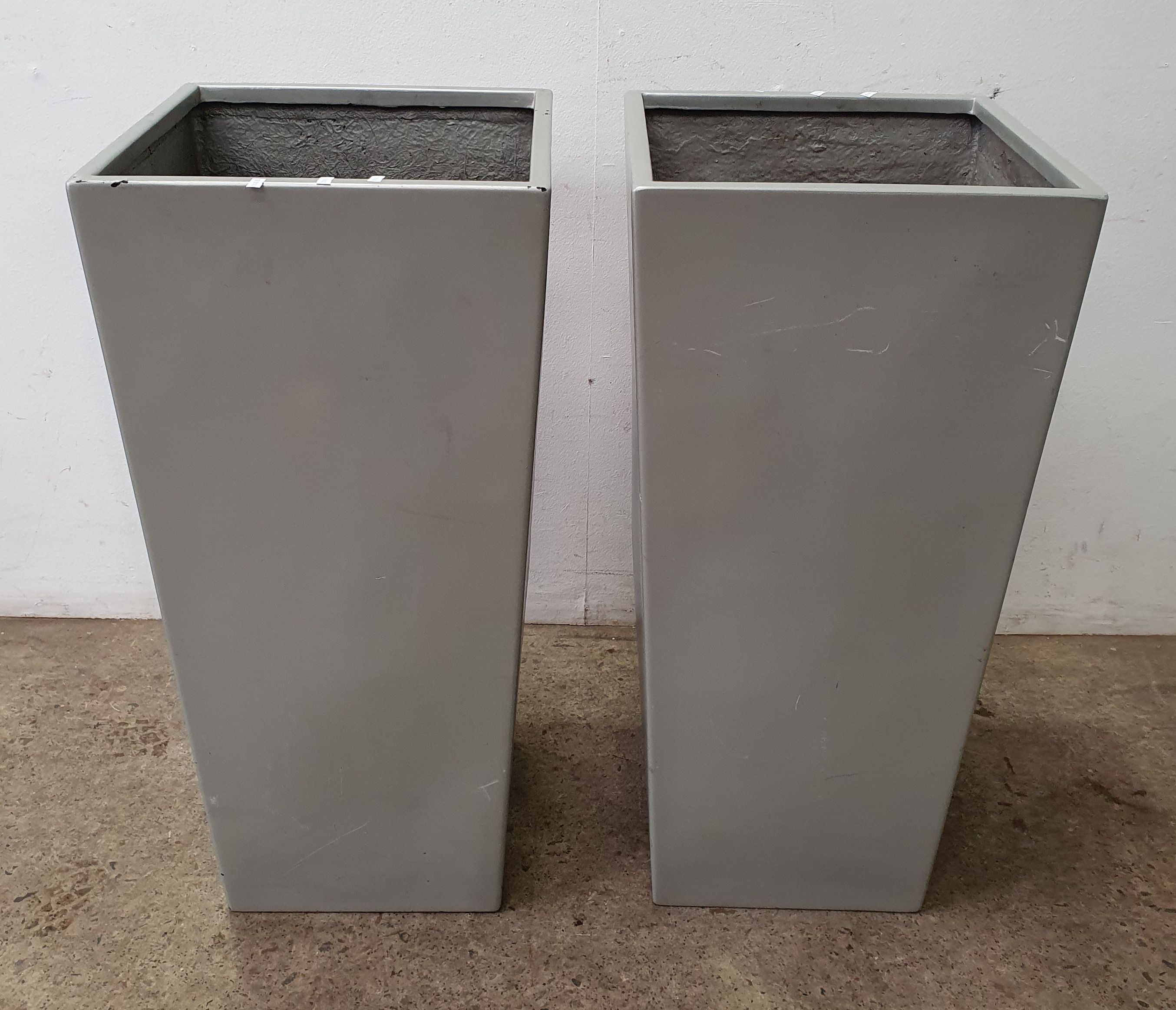1114 · A PAIR OF LARGE FIBREGLASS POTS