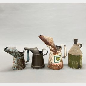 Three vintage oil cans and one varnish can, tallest 26cm.