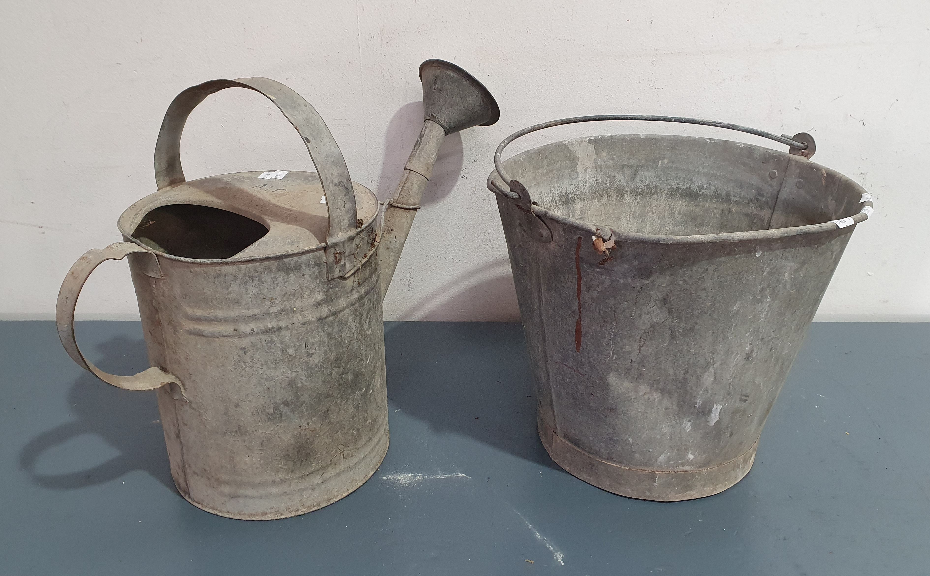 A Vintage Bucket And Watering Can