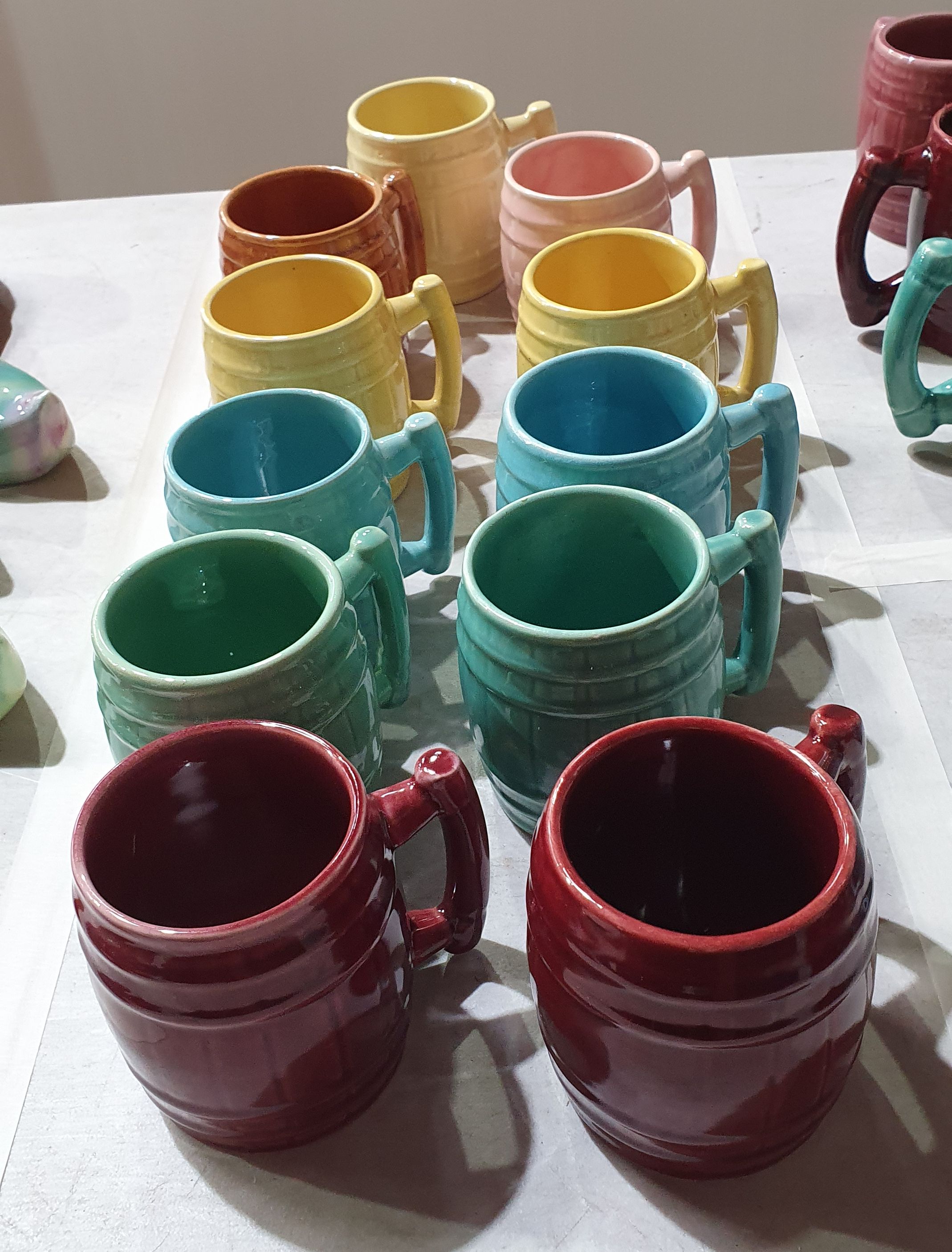 440 · A COLLECTION OF MCP BARREL MUGS