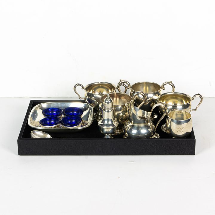 A lot of sterling and sterling weighted table articles, including solid silver: a Reed & Barton Classic Rose square tray x260; a sma...