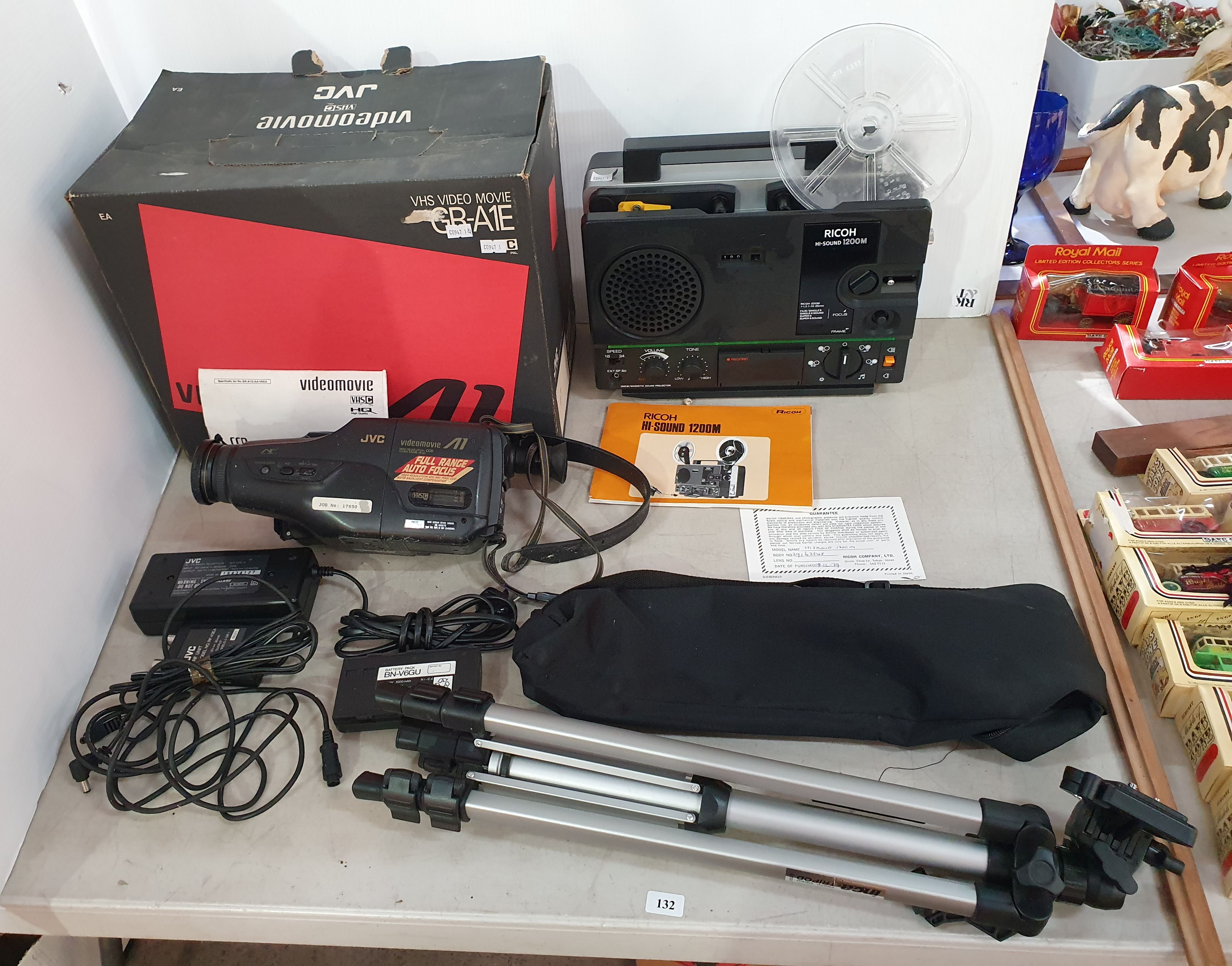 132 · A RICOH MOVIE PROJECTOR AND A VHS VIDEO MOVIE CAMERA TOGETHER WITH A TRIPOD