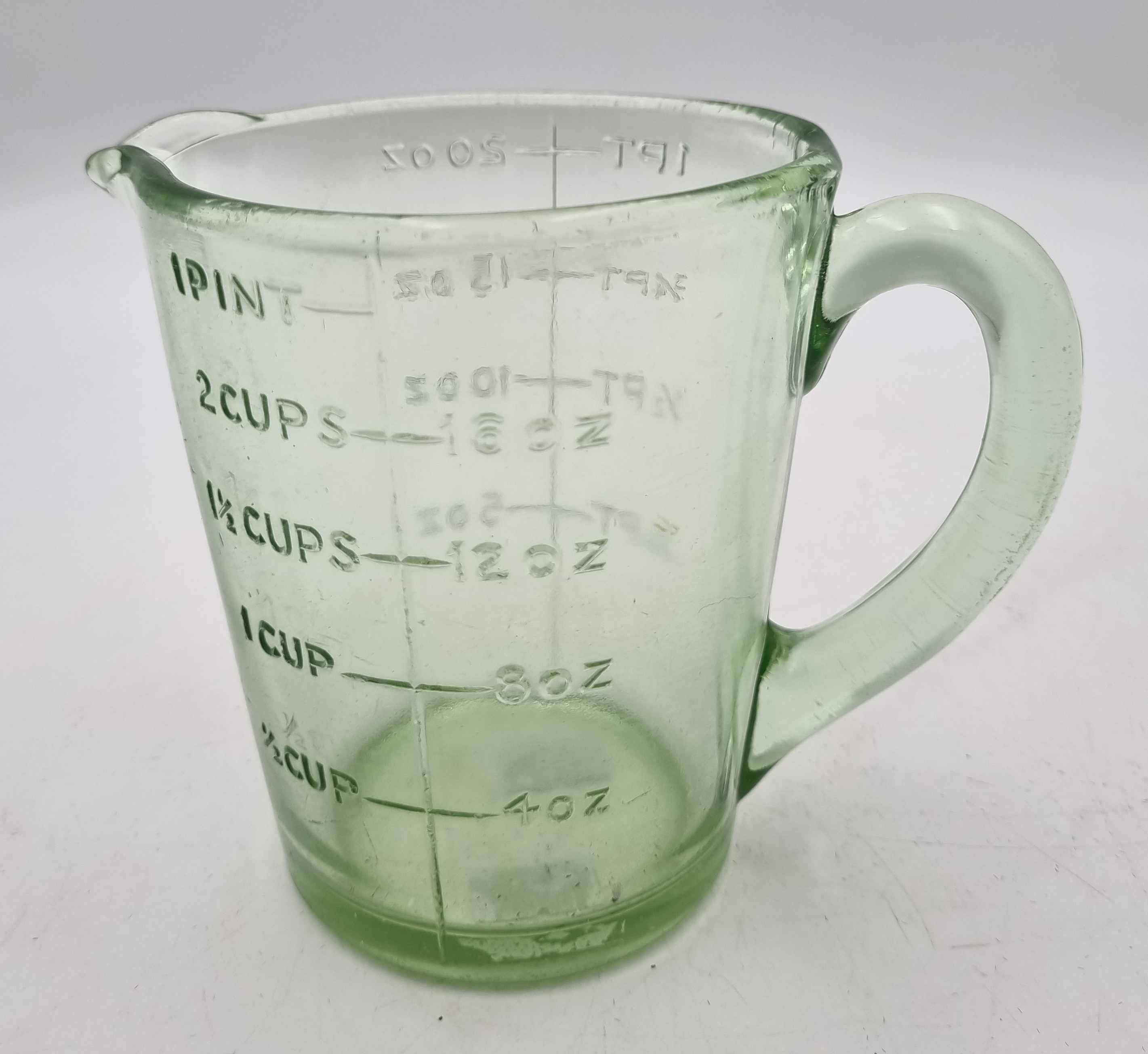 545 · AN ART-DECO ERA URANIUM GLASS MEASURING PITCHER