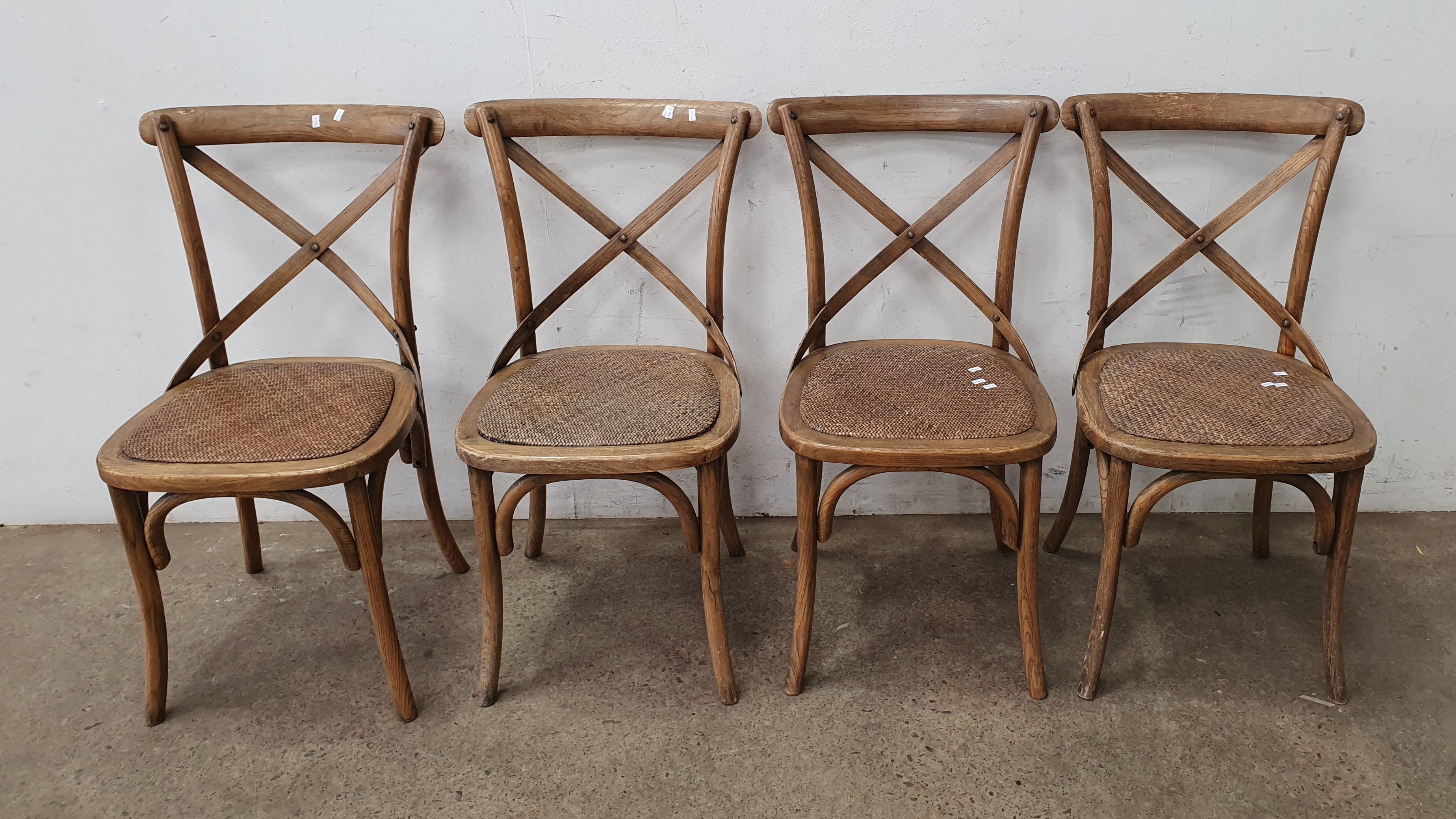 A Group Of Four Dining Chairs