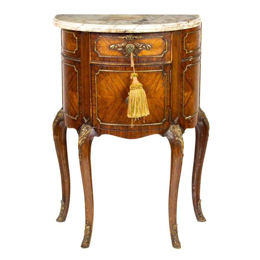 A Louis XV style demilune chest