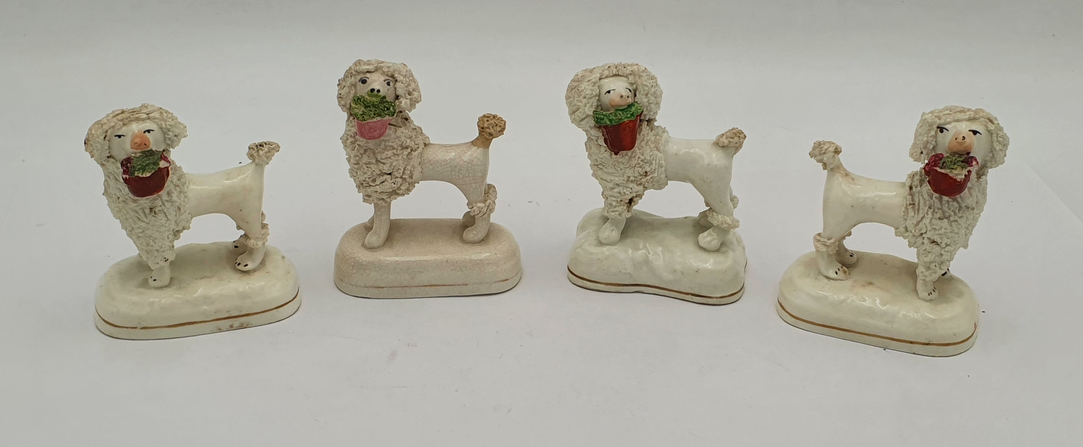 547 · FOUR 19TH CENTURY STAFFORDSHIRE POODLE FIGURES