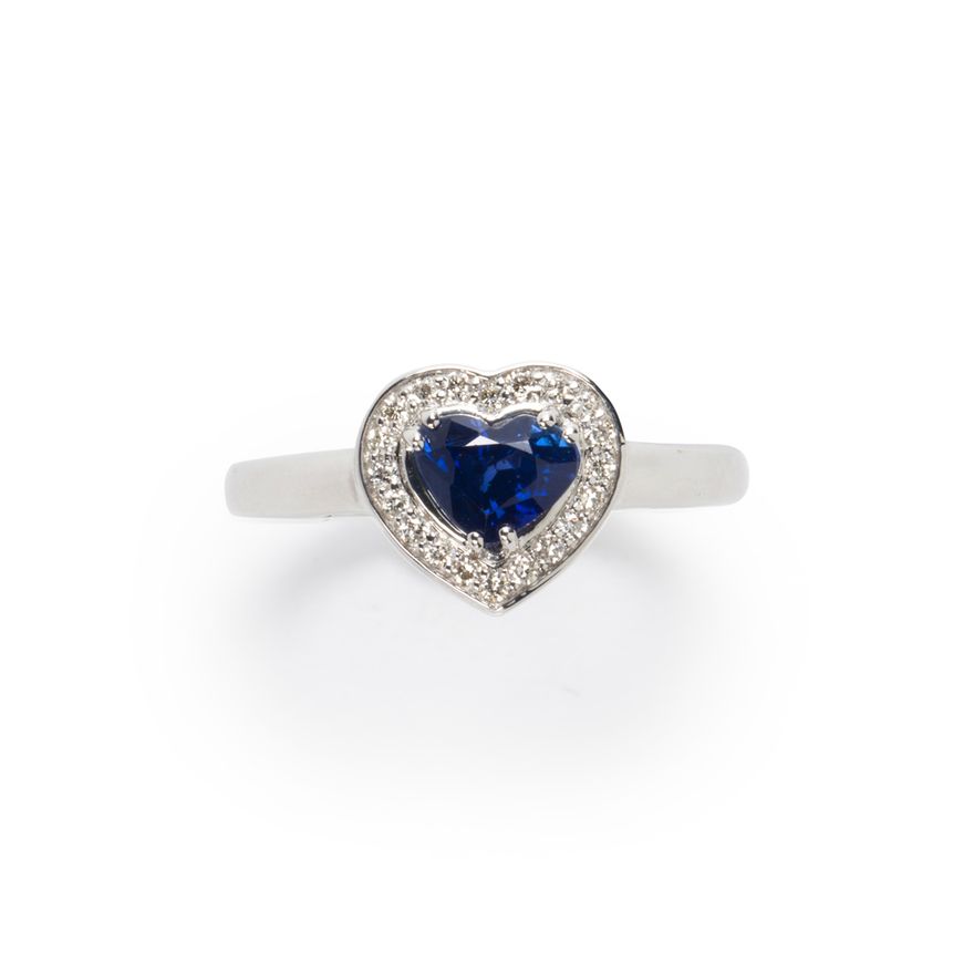 A sapphire, diamond and fourteen karat white gold ring