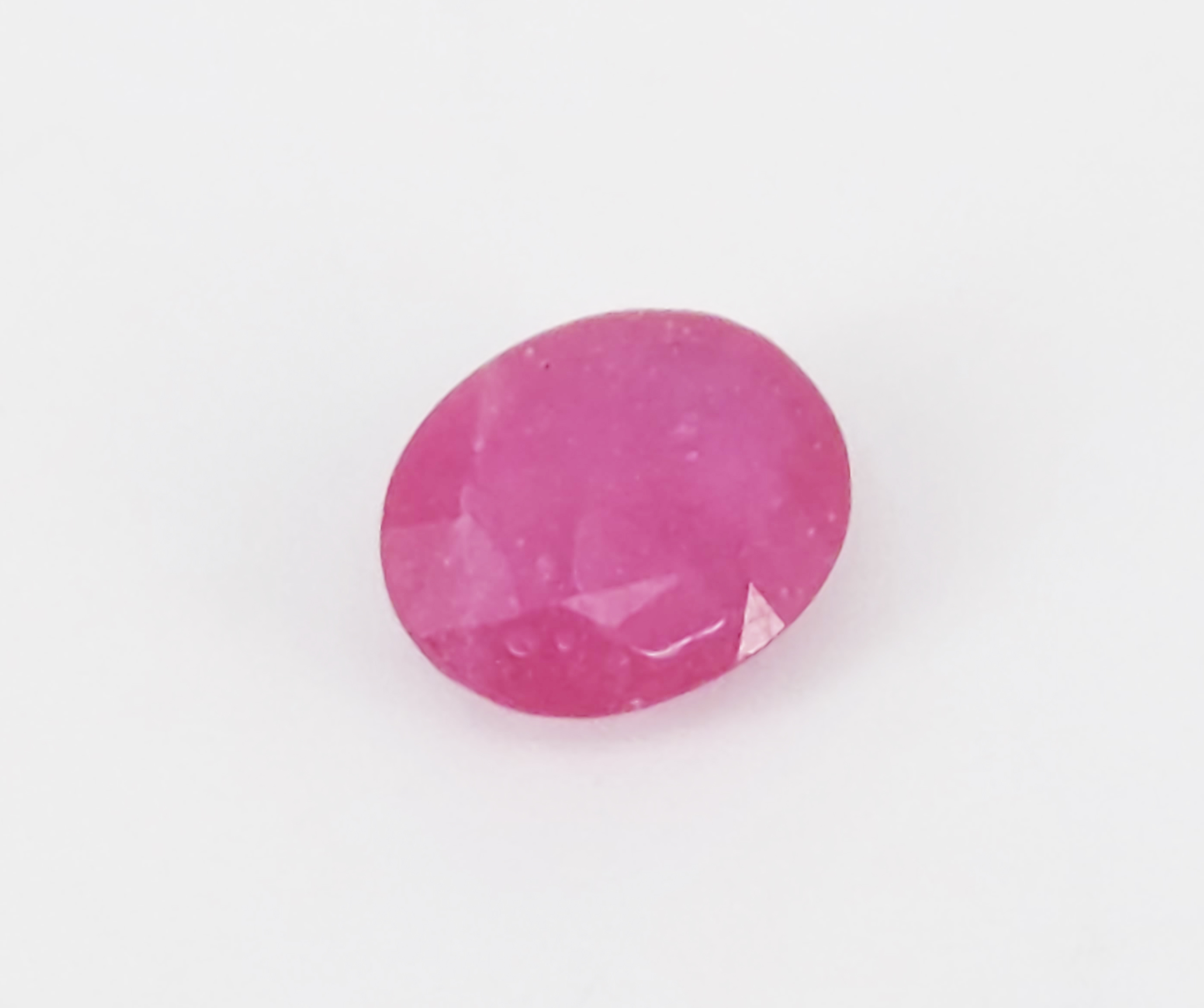 A LOOSE OVAL CUT RUBY
