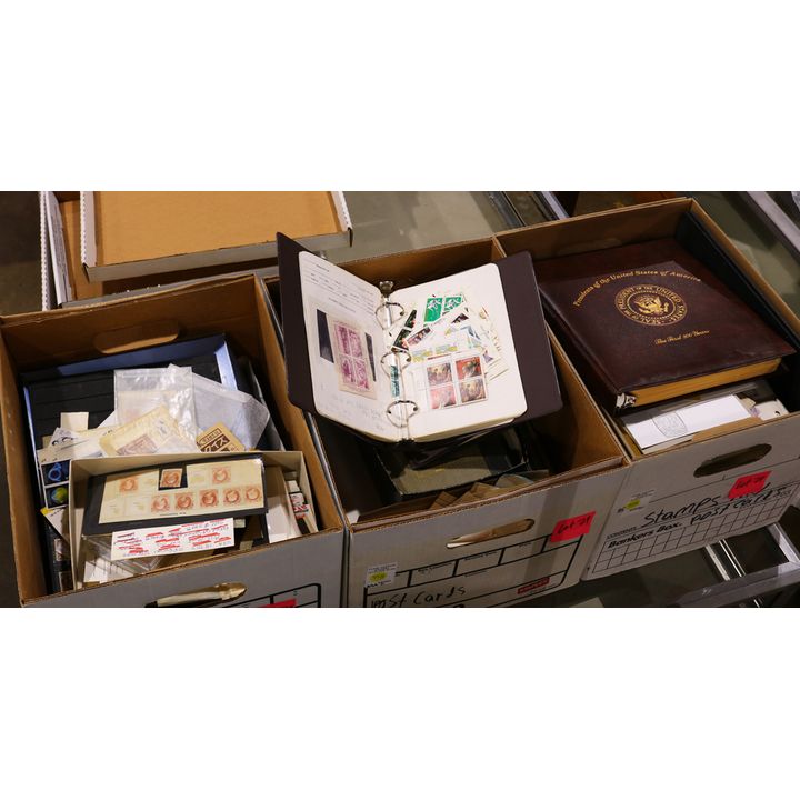 Three boxes of stamps with an emphasis on Canada and Great Britian