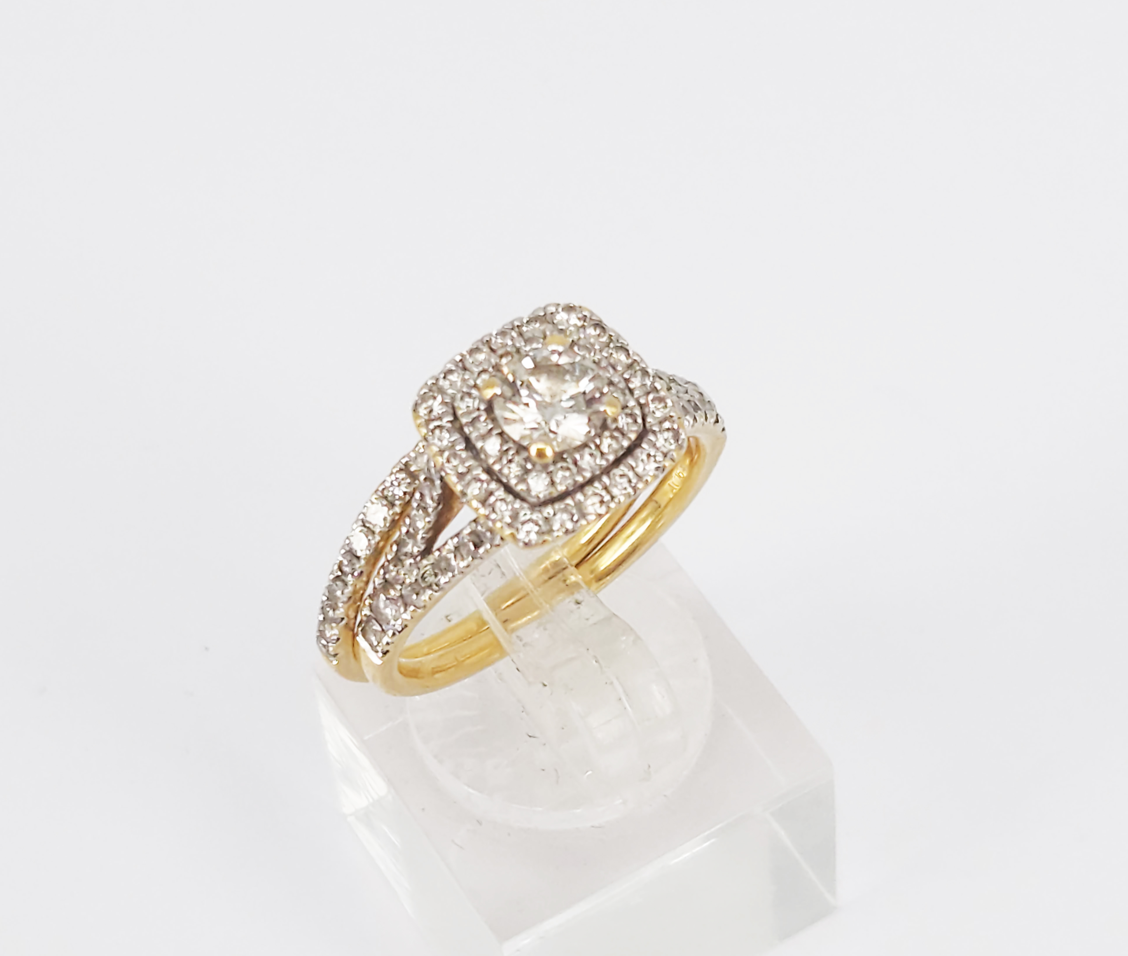 An 18ct Yellow Gold And Diamond Cluster Engagement Ring And Band Set