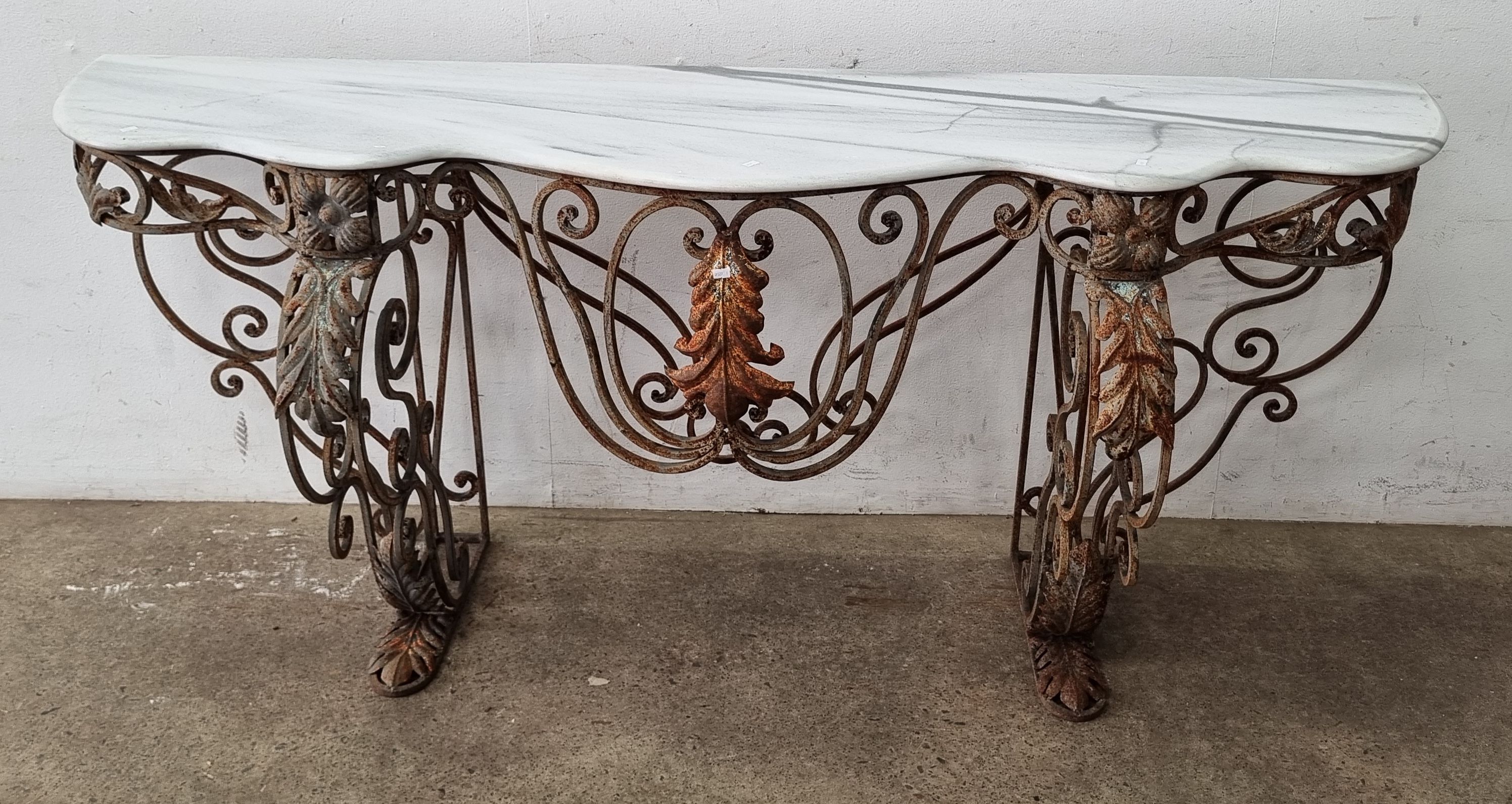 A Marble Top Console On Wrought Iron Base