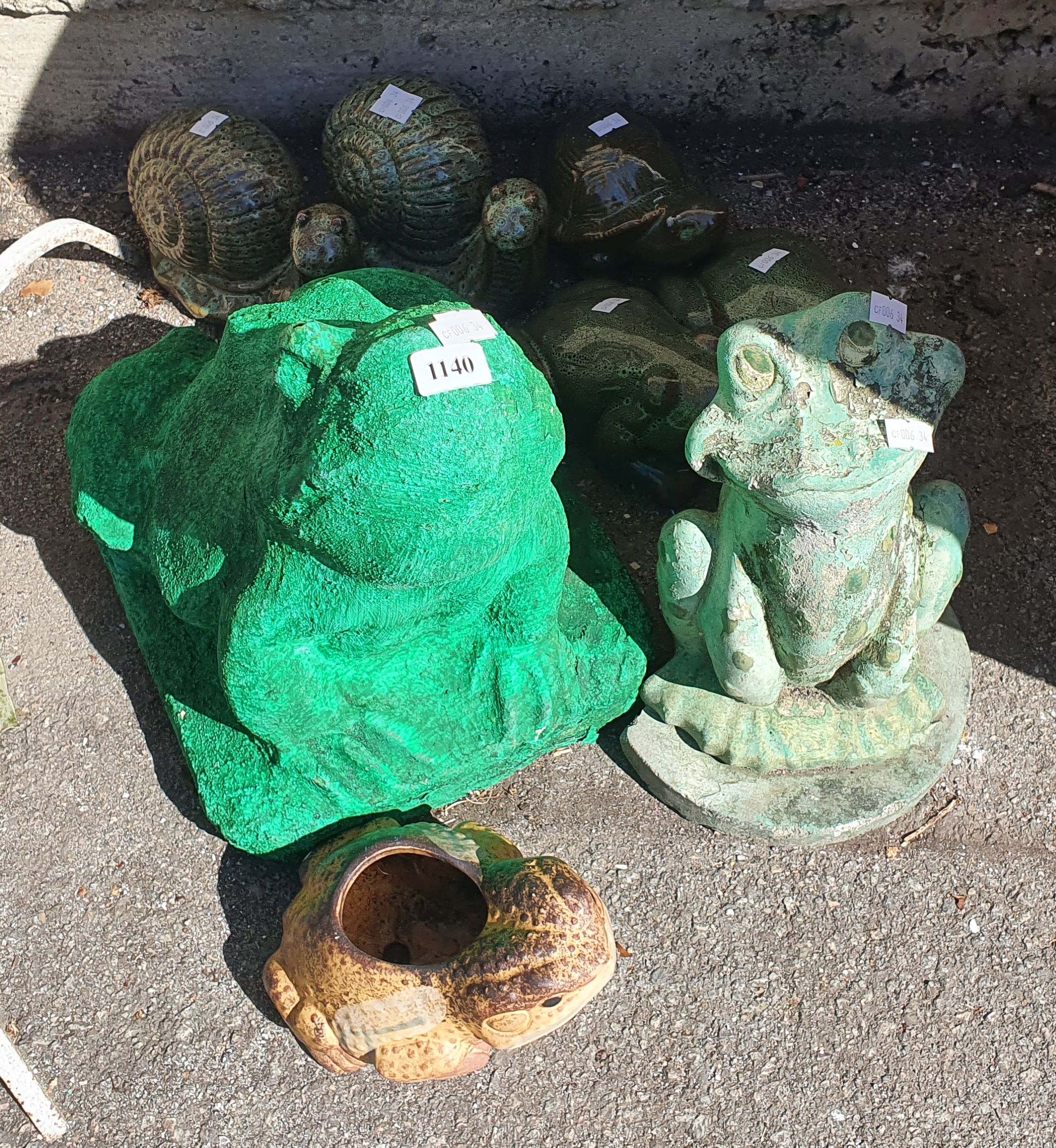 1140 · A GROUP OF GARDEN FROGS